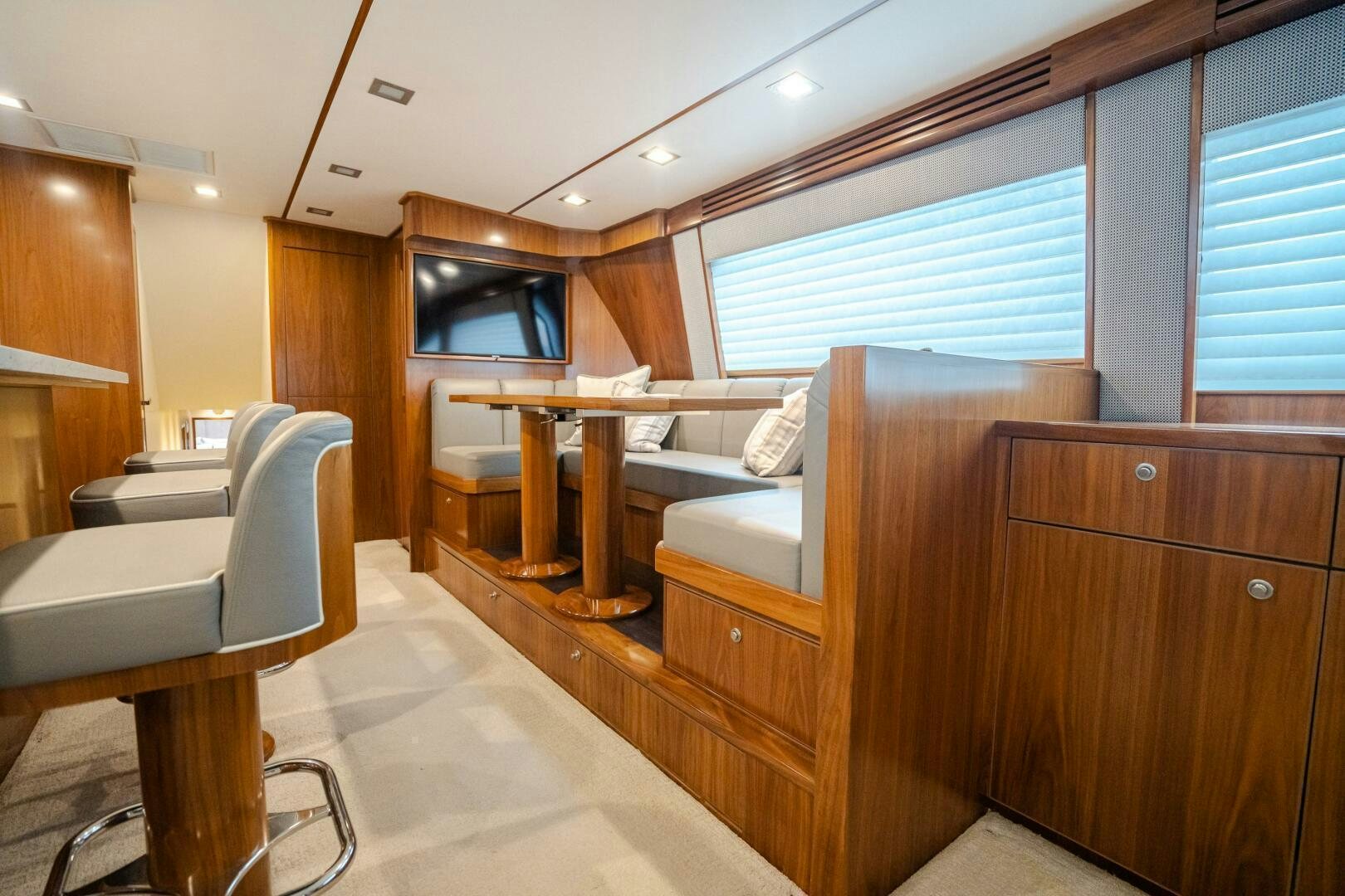 a room with a wood desk and a chair aboard HOORAY Yacht for Sale
