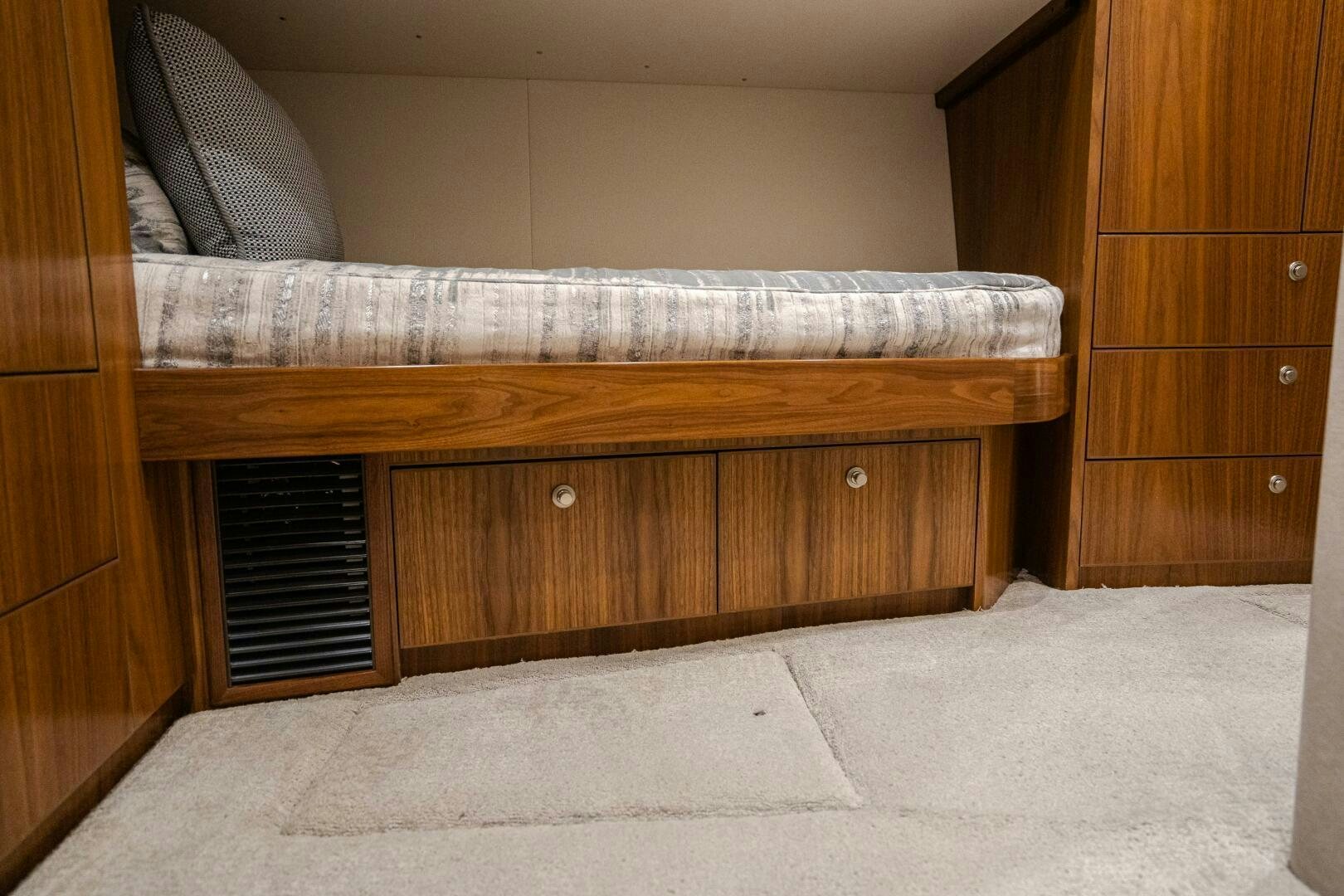 a bed with a wooden frame aboard HOORAY Yacht for Sale