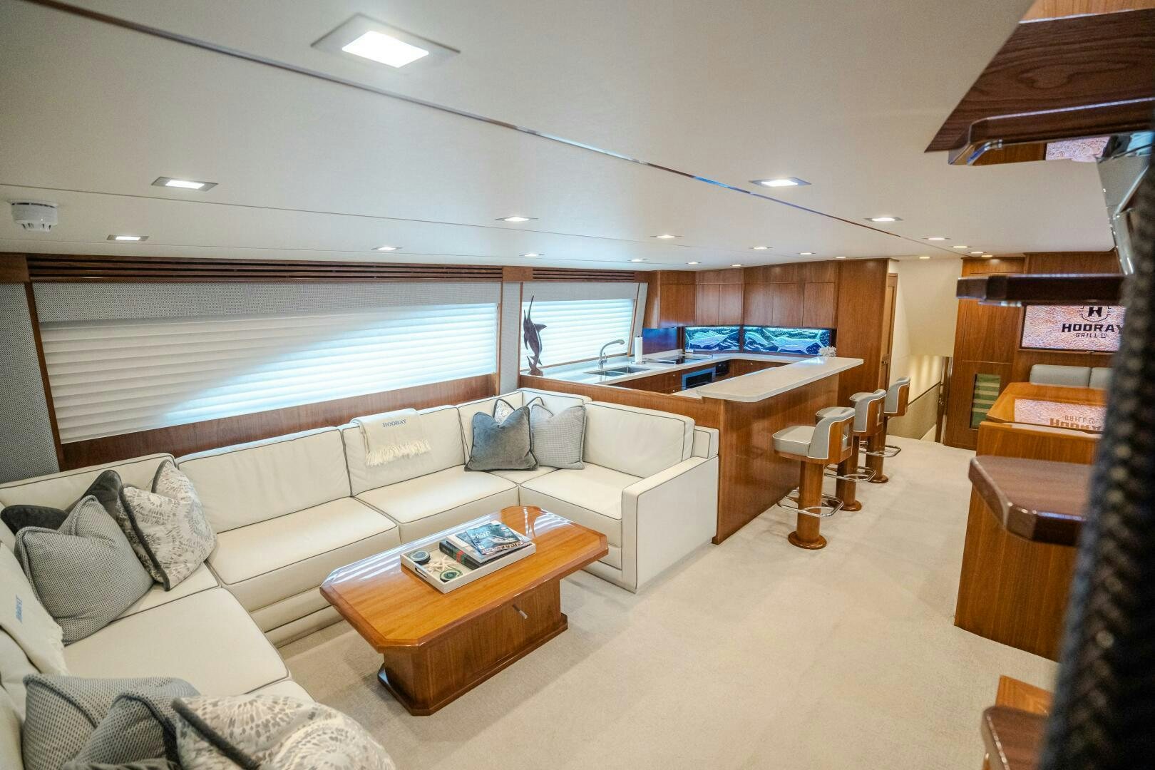 a living room with a couch and a table aboard HOORAY Yacht for Sale