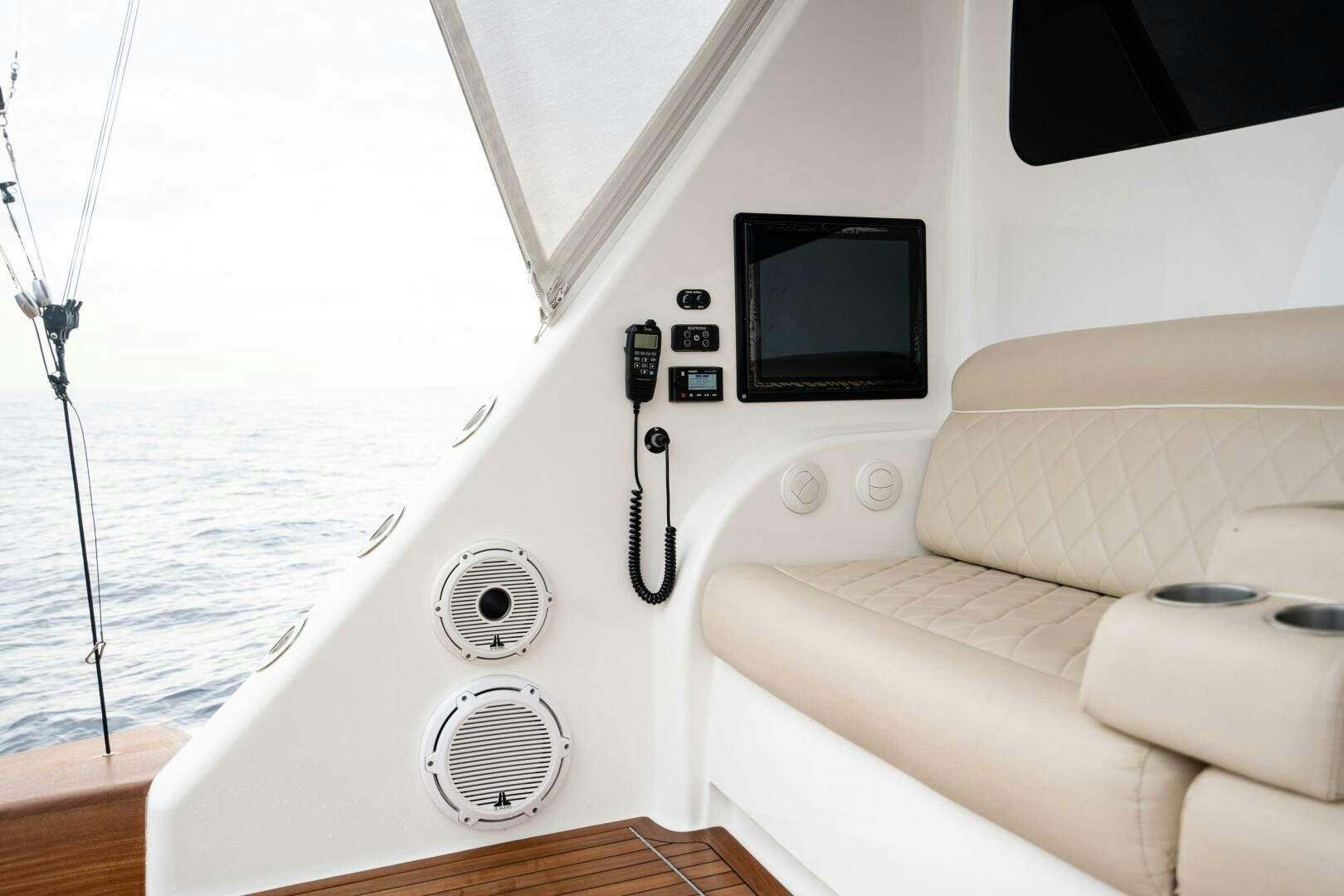 a white boat with black knobs aboard HOORAY Yacht for Sale