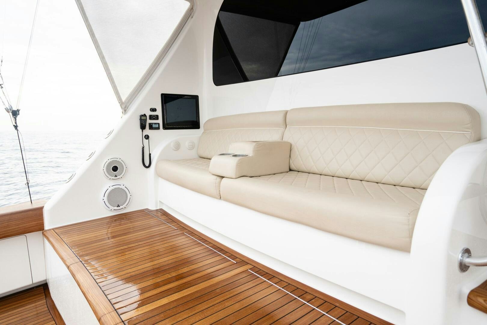 a white couch in a room aboard HOORAY Yacht for Sale