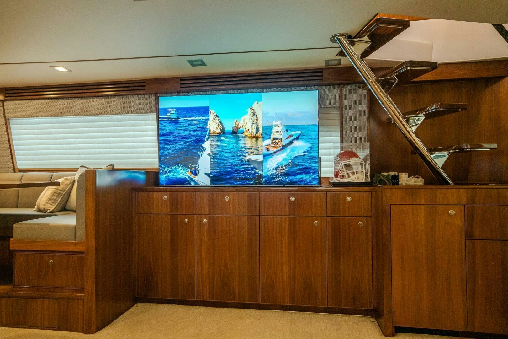 a room with a tv and a couch aboard HOORAY Yacht for Sale