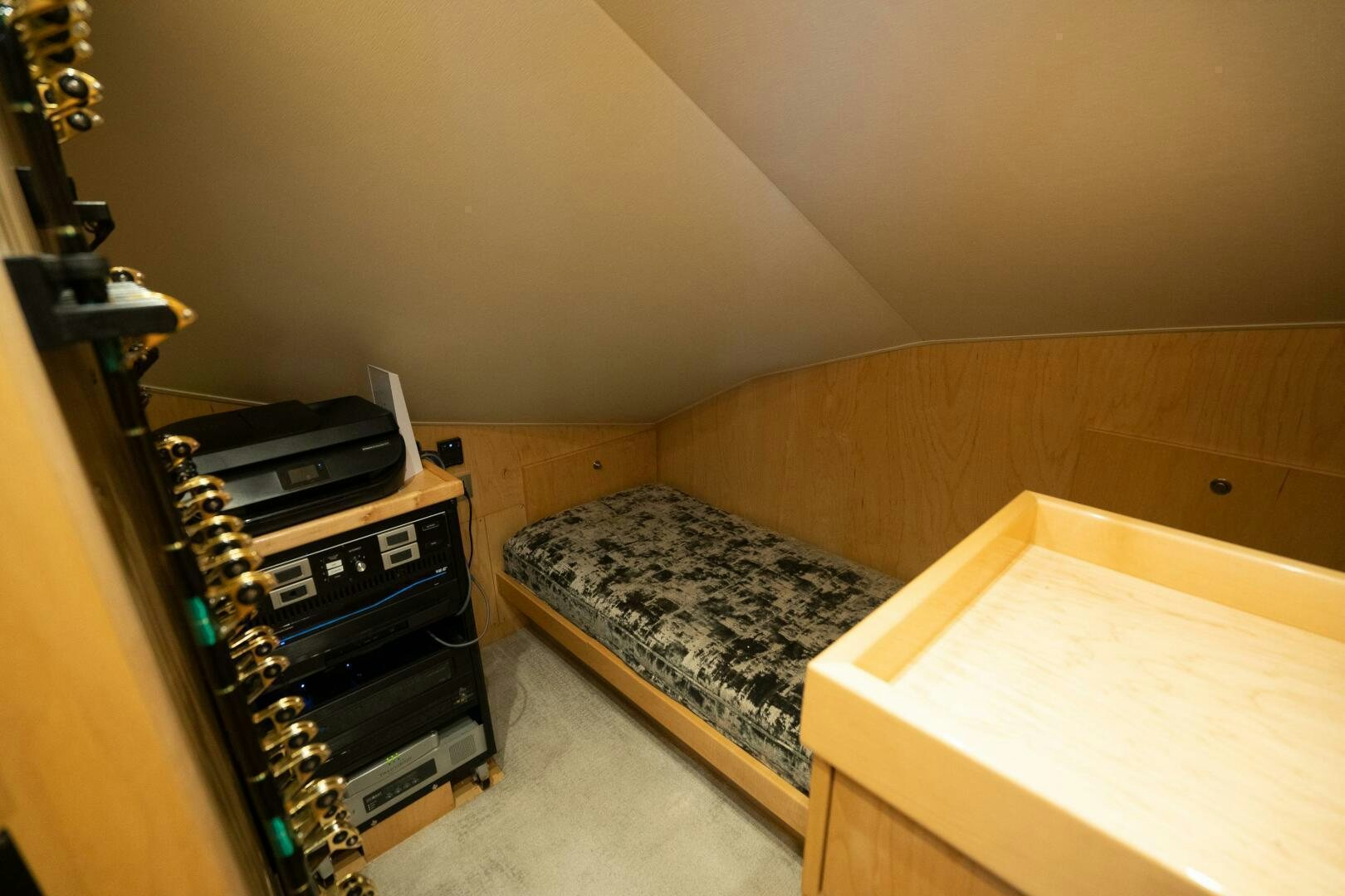 a room with a bed and a desk aboard HOORAY Yacht for Sale