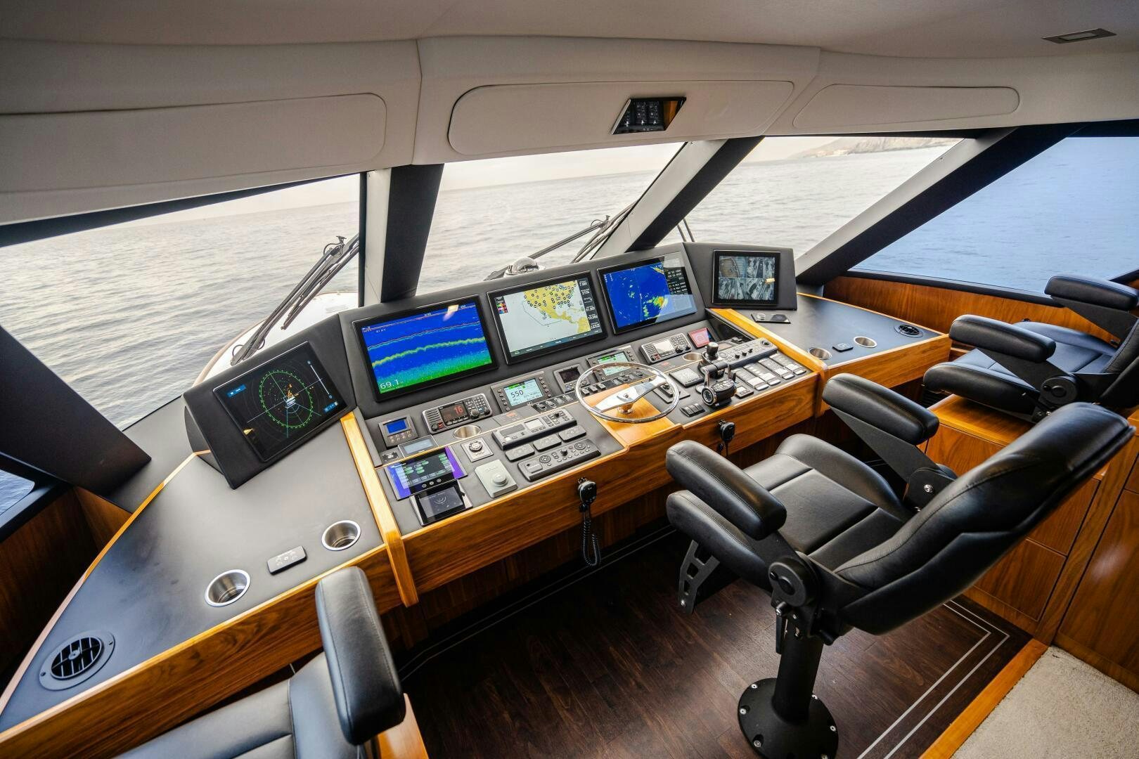 a control room with many monitors aboard HOORAY Yacht for Sale