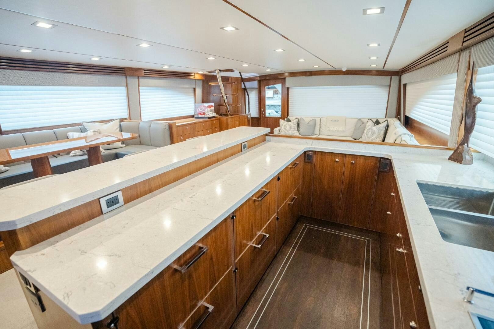 a kitchen with wooden cabinets aboard HOORAY Yacht for Sale
