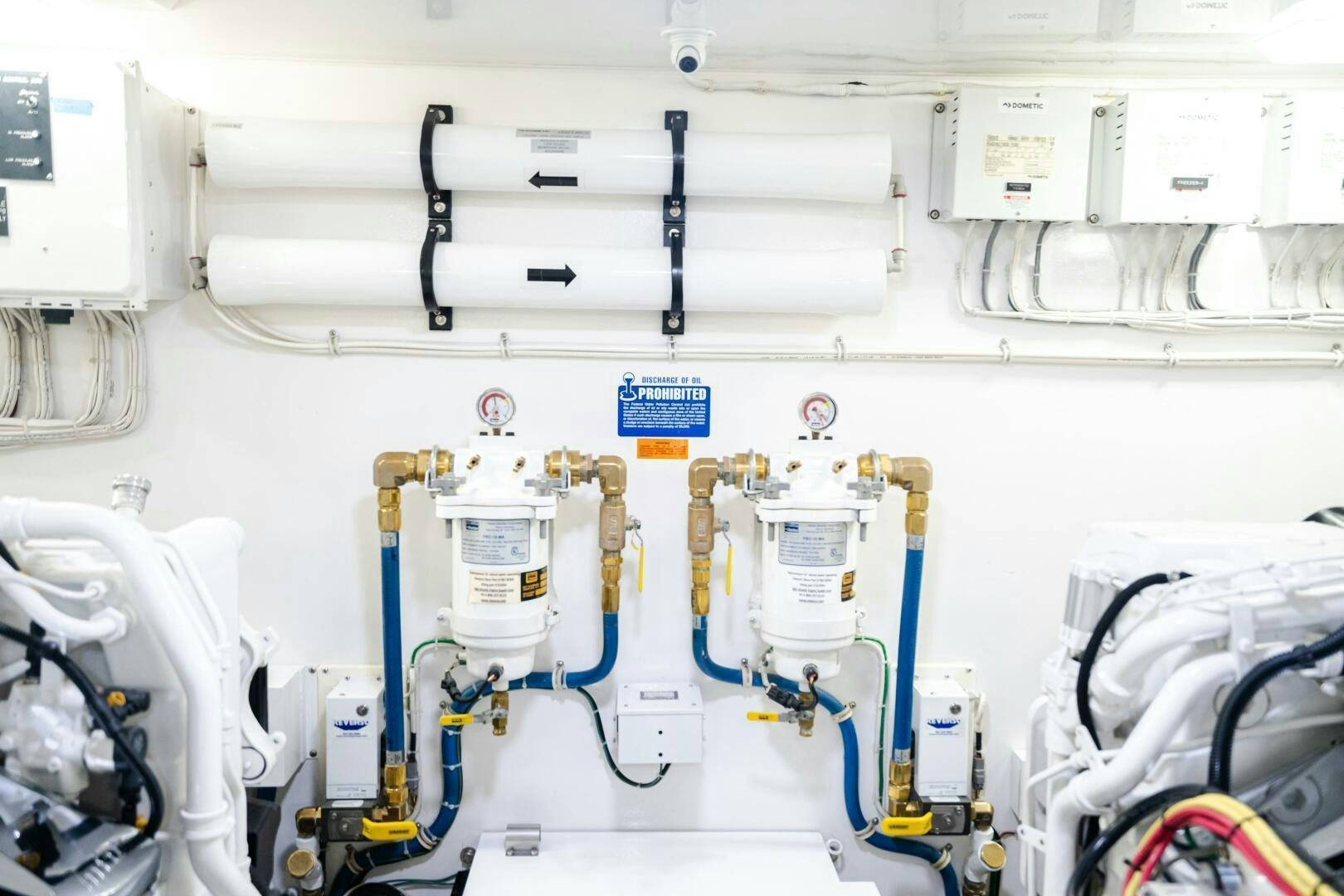 a white machine with blue and yellow wires aboard HOORAY Yacht for Sale