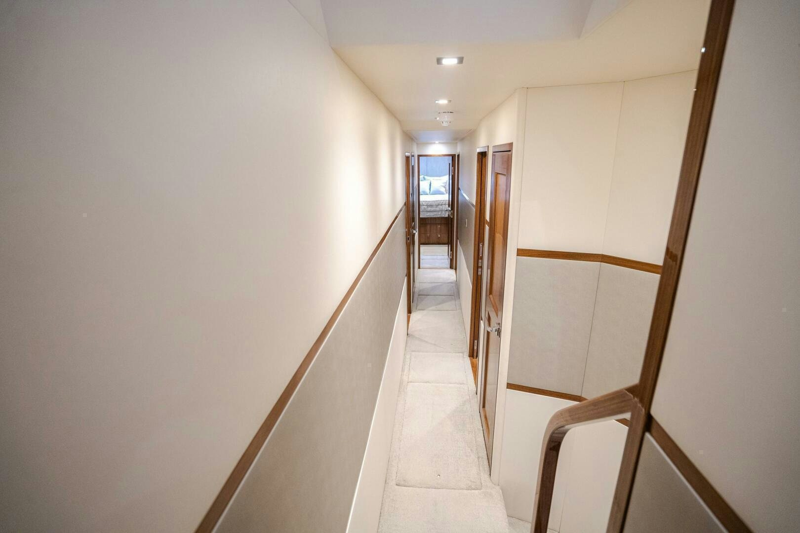 a hallway with white walls aboard HOORAY Yacht for Sale