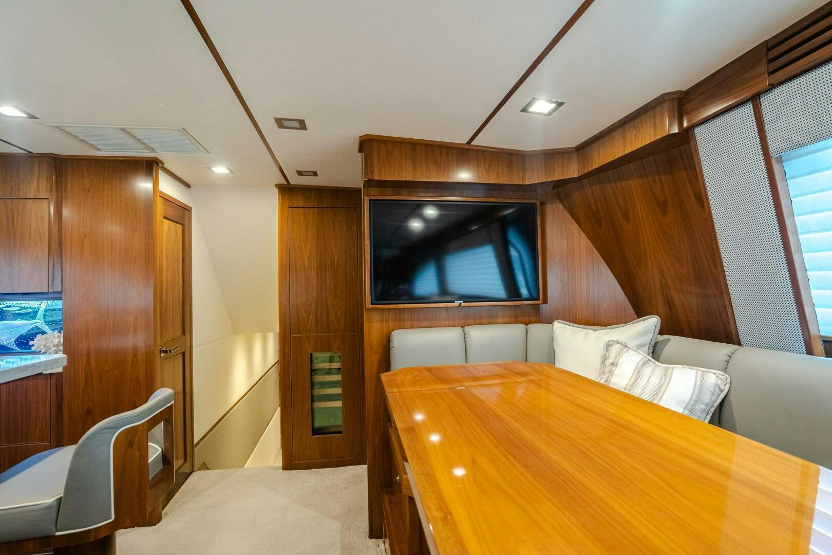 a room with a bed and a table aboard HOORAY Yacht for Sale
