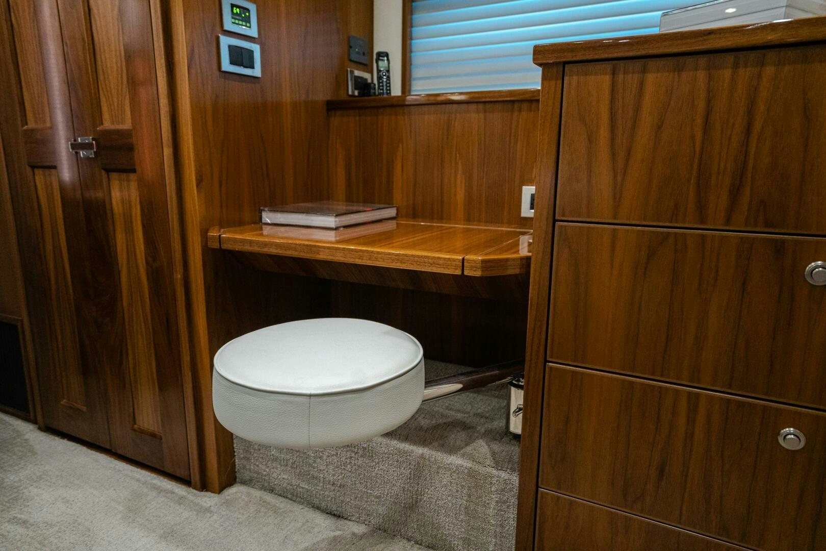 a toilet in a wooden room aboard HOORAY Yacht for Sale