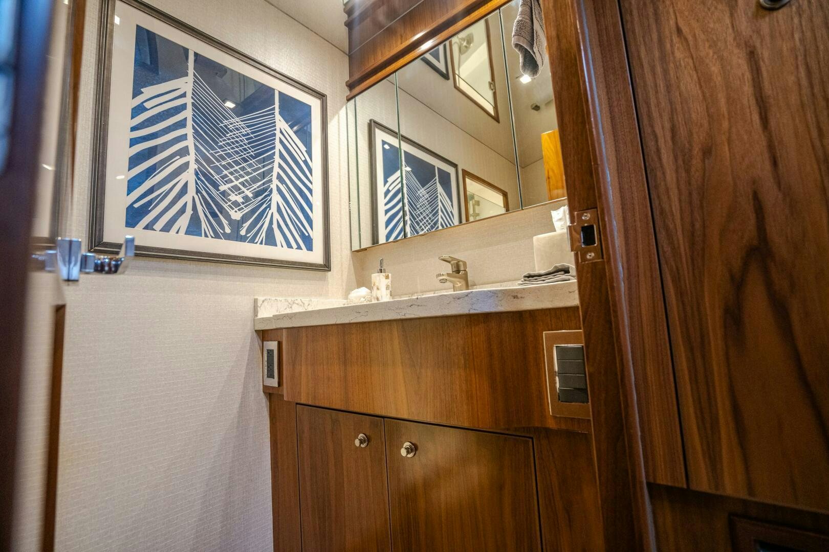 a bathroom with a sink and a mirror aboard HOORAY Yacht for Sale