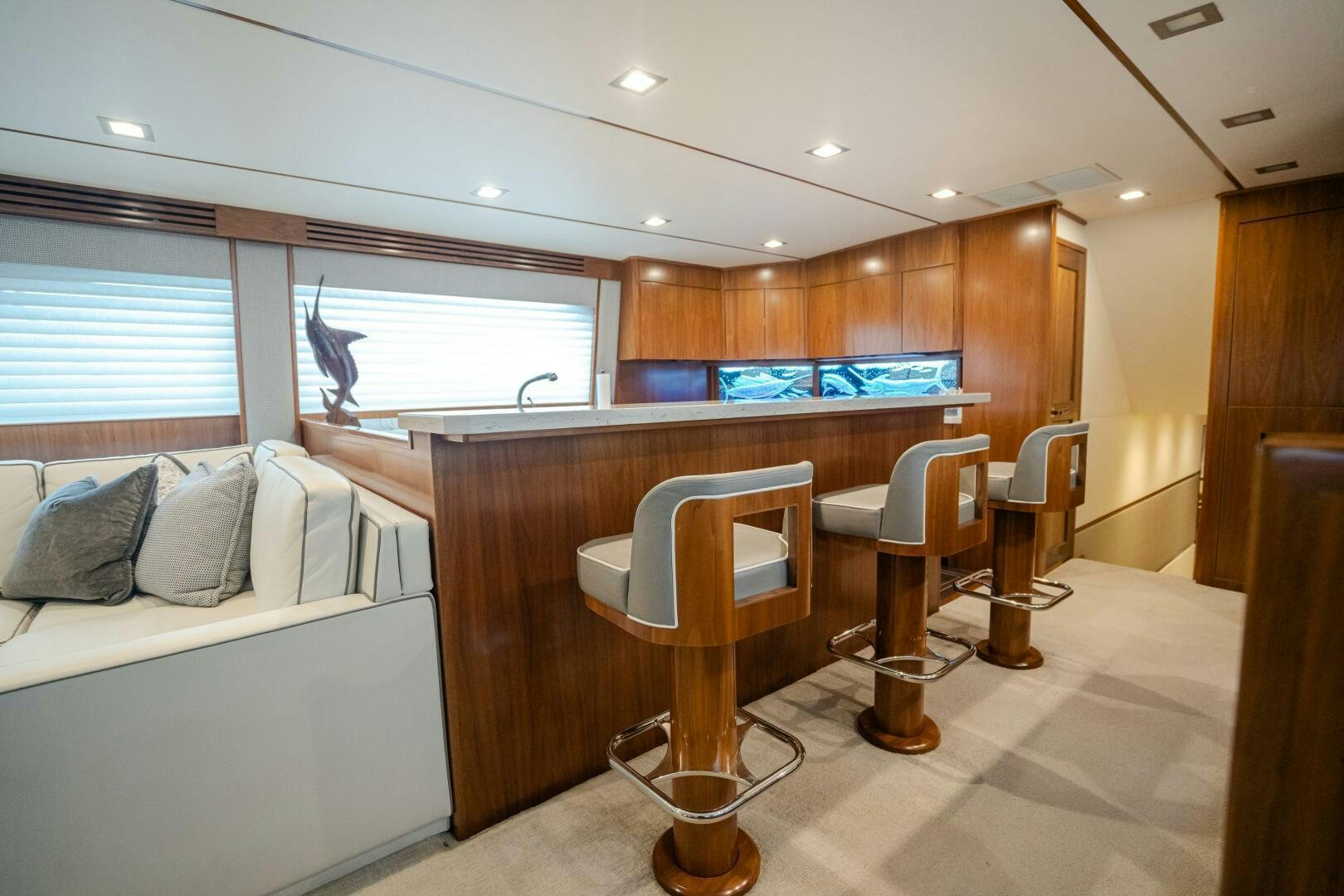 a room with a bed and a desk aboard HOORAY Yacht for Sale