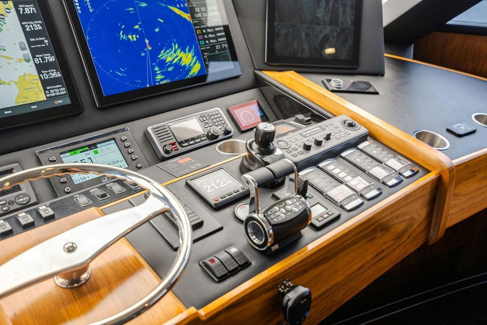 a desk with a computer and other electronics on it aboard HOORAY Yacht for Sale