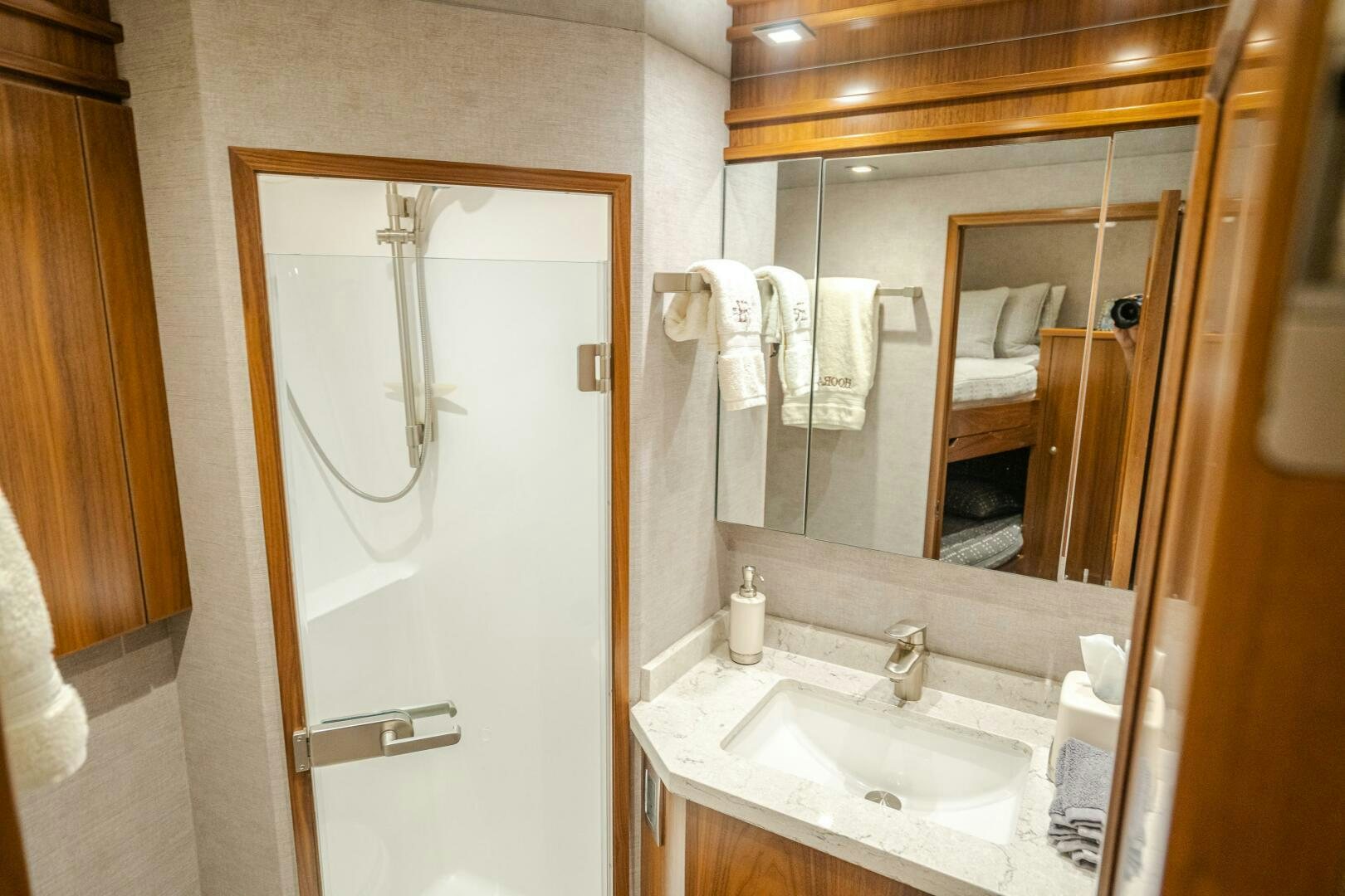 a bathroom with a large mirror aboard HOORAY Yacht for Sale