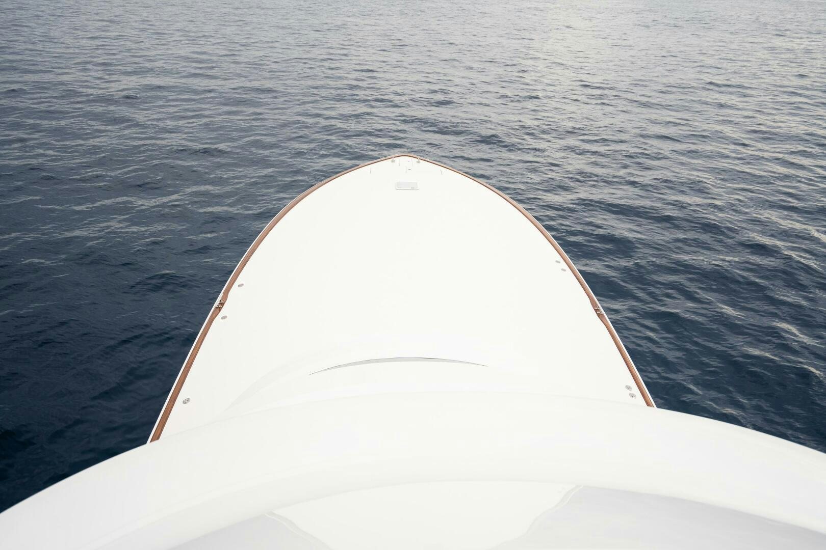 a white kayak on water aboard HOORAY Yacht for Sale