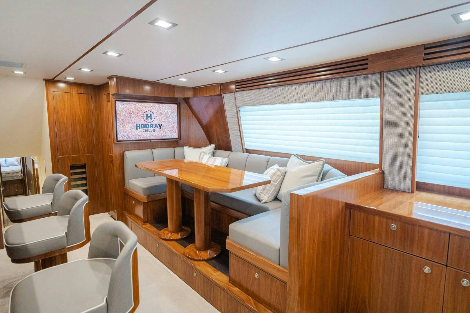 a room with a couch and a table aboard HOORAY Yacht for Sale