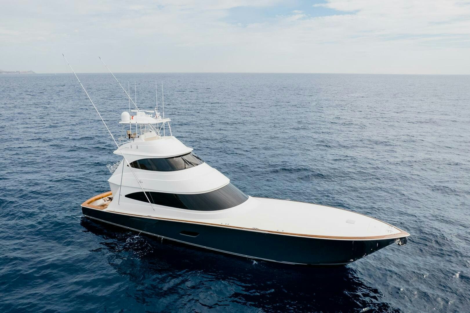 a white boat in the water aboard HOORAY Yacht for Sale