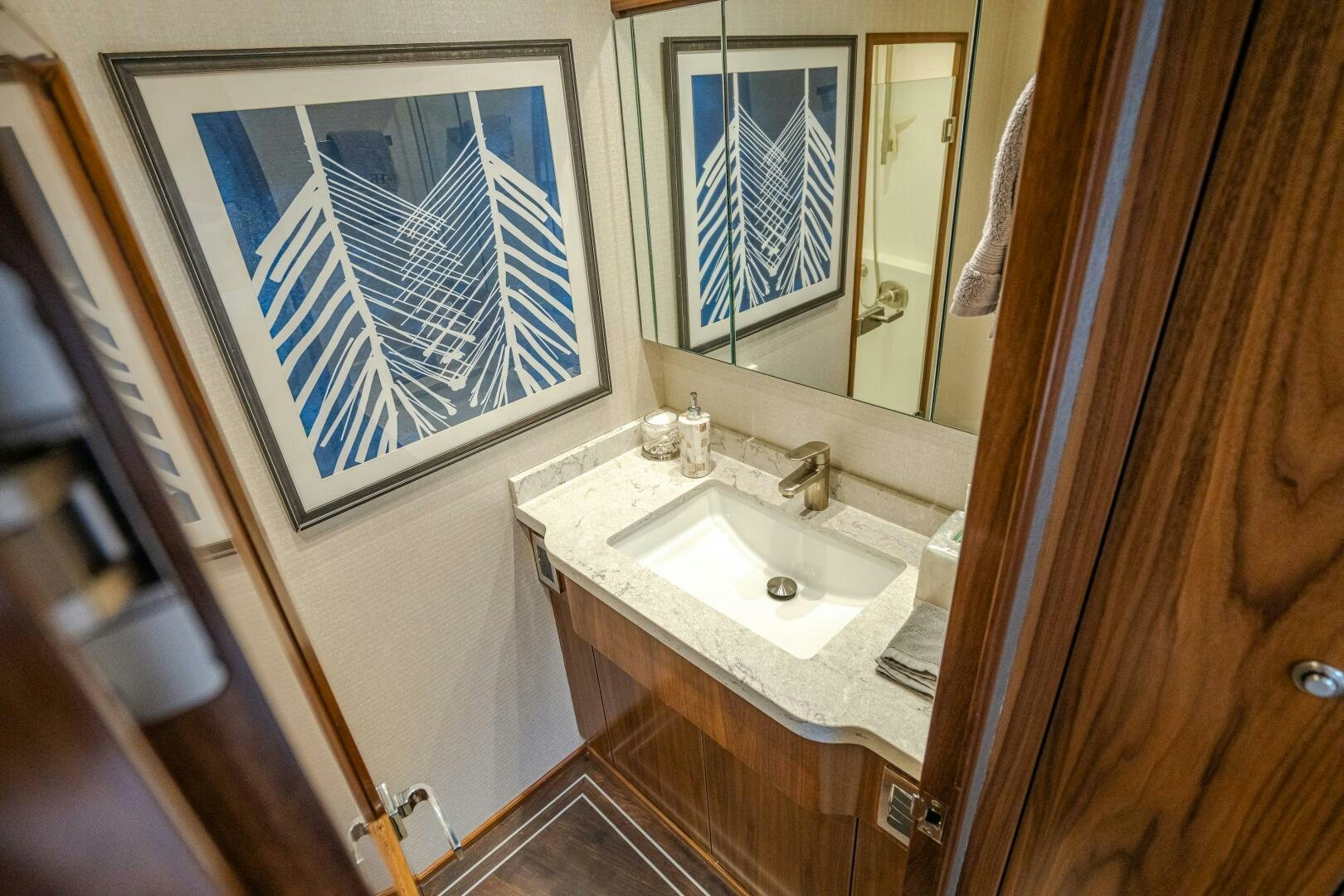 a bathroom with a sink and a mirror aboard HOORAY Yacht for Sale