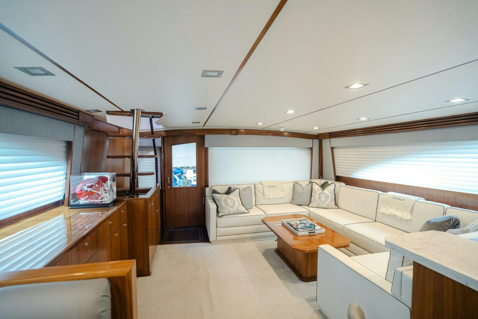 a living room with a couch and a table aboard HOORAY Yacht for Sale