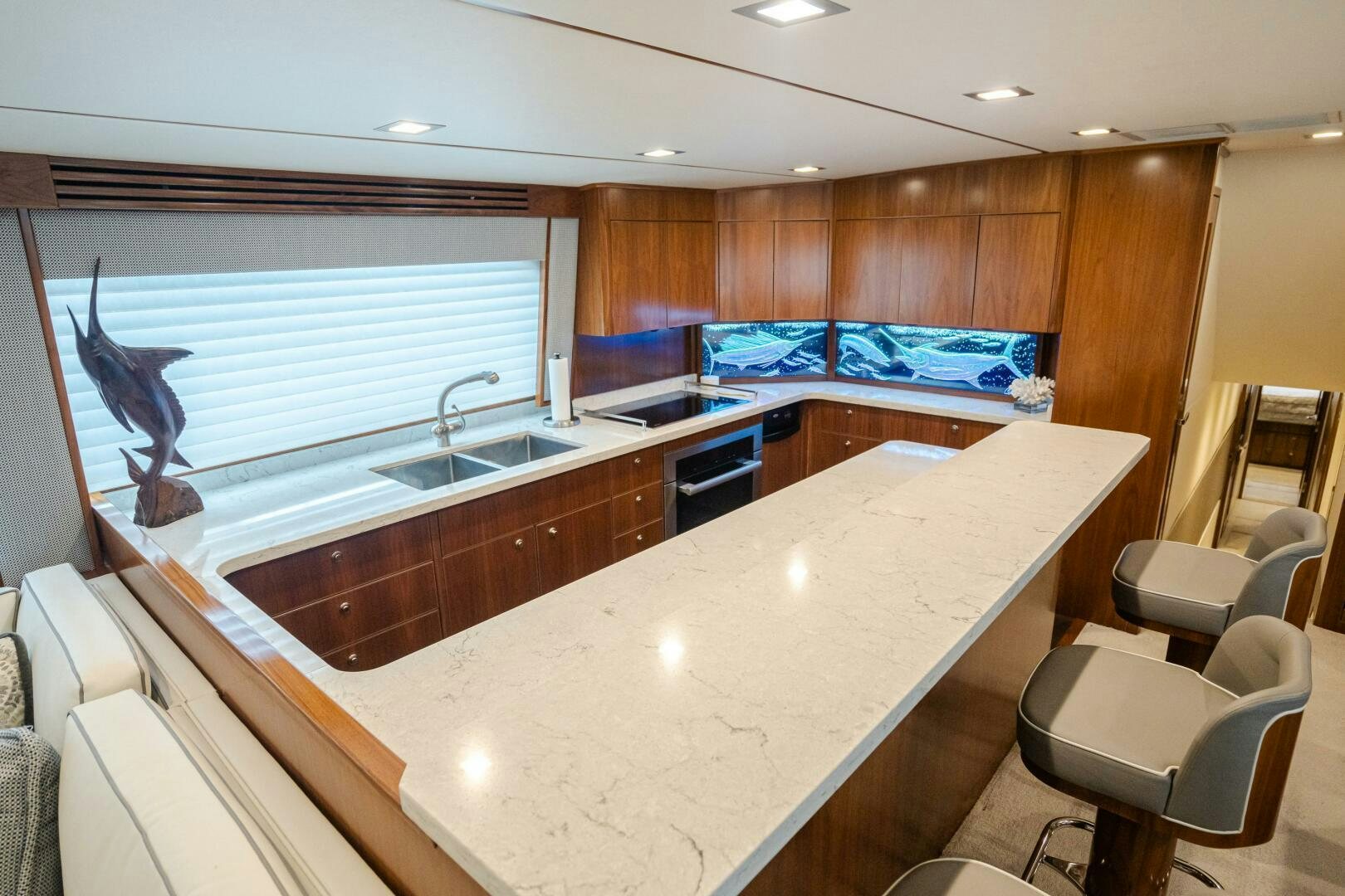 a large kitchen with a large island aboard HOORAY Yacht for Sale