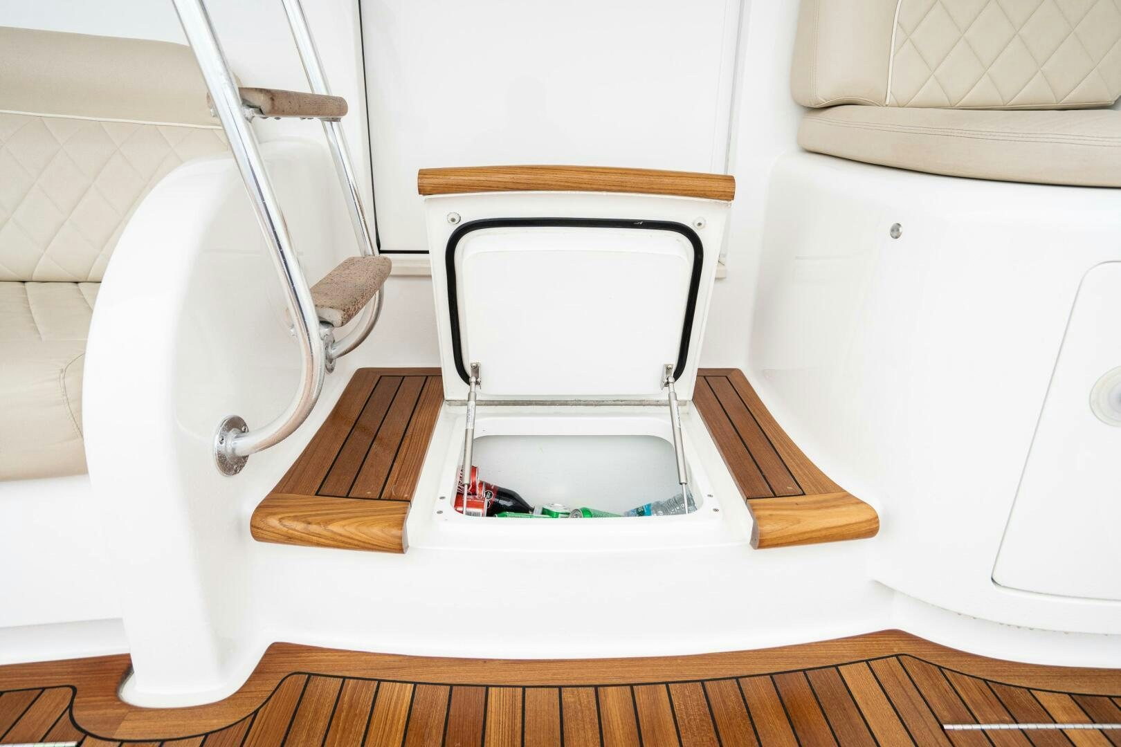 a white chair with a seat aboard HOORAY Yacht for Sale