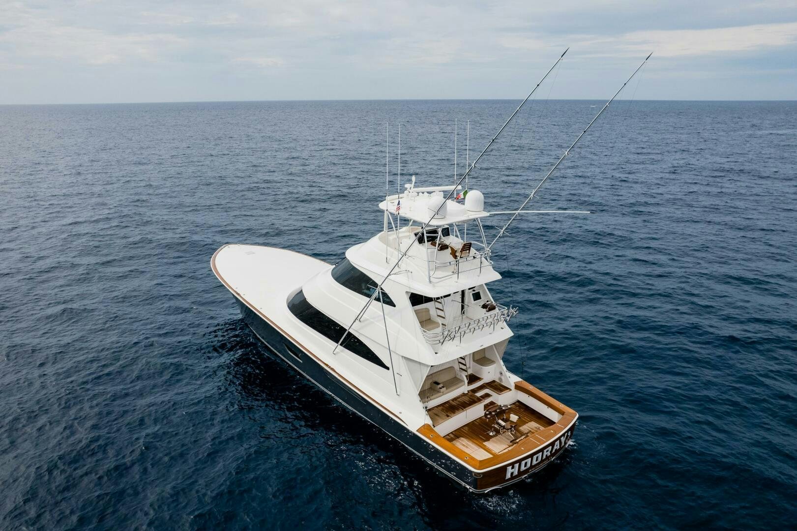 a fishing boat in the water aboard HOORAY Yacht for Sale