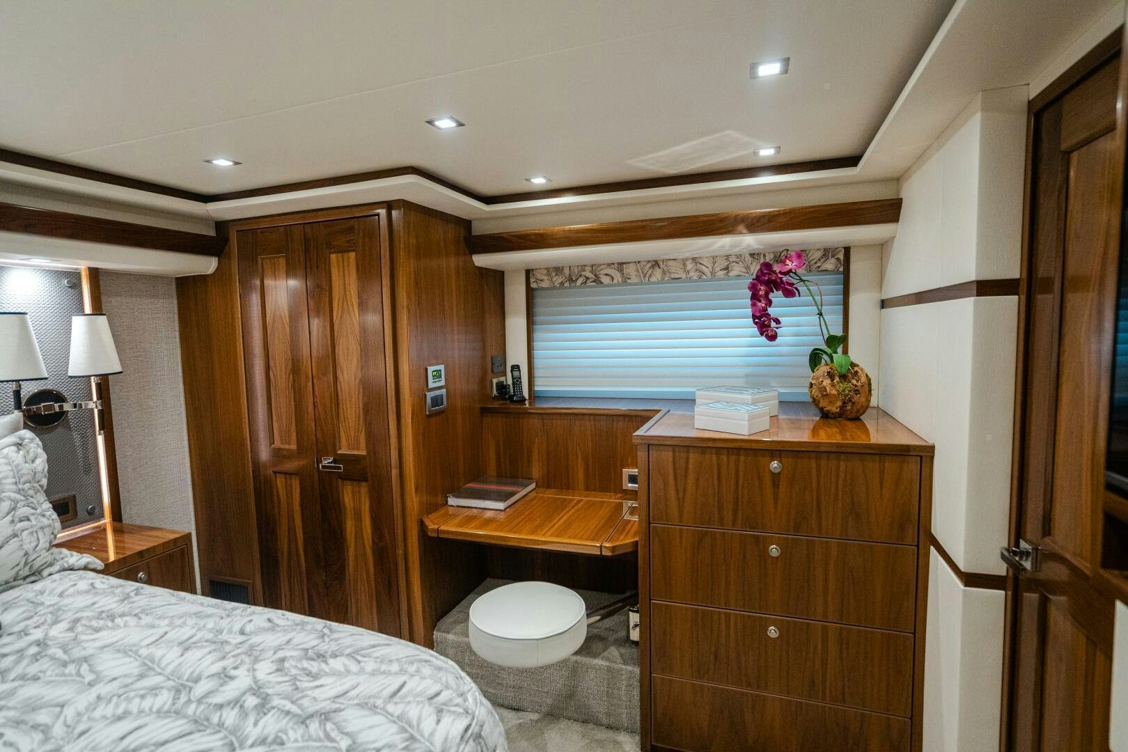 a bedroom with a wood cabinet aboard HOORAY Yacht for Sale