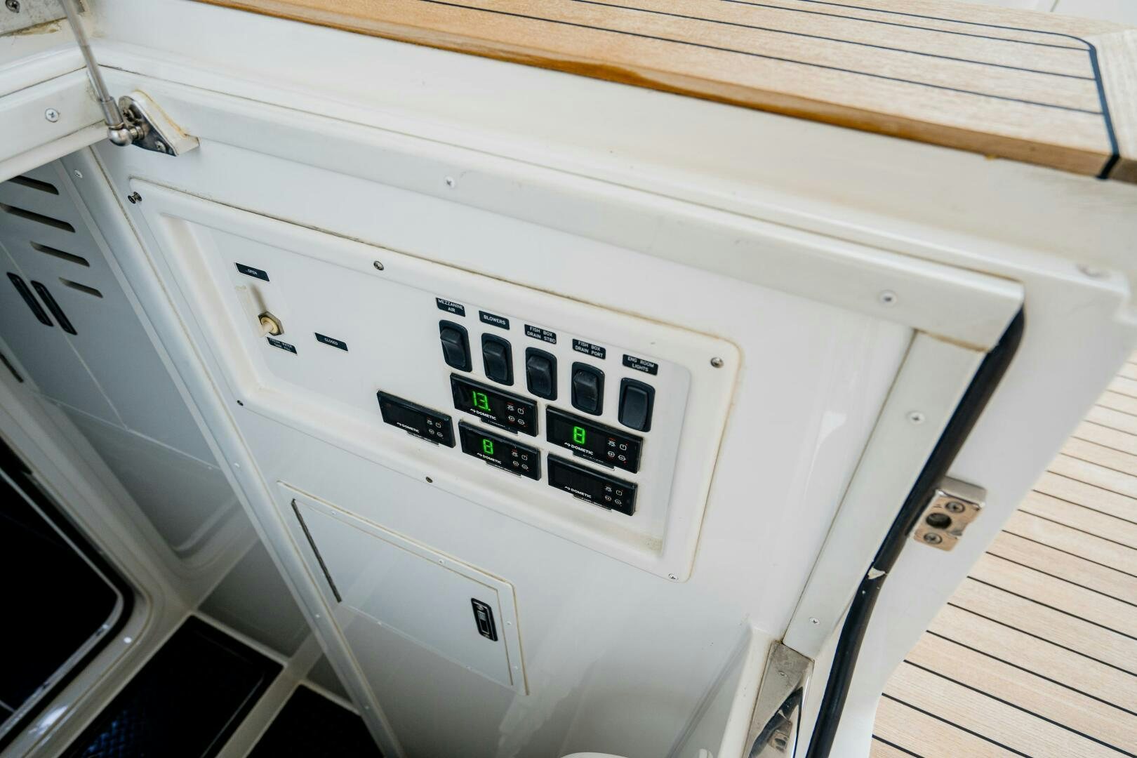 a white machine with a black dial aboard HOORAY Yacht for Sale