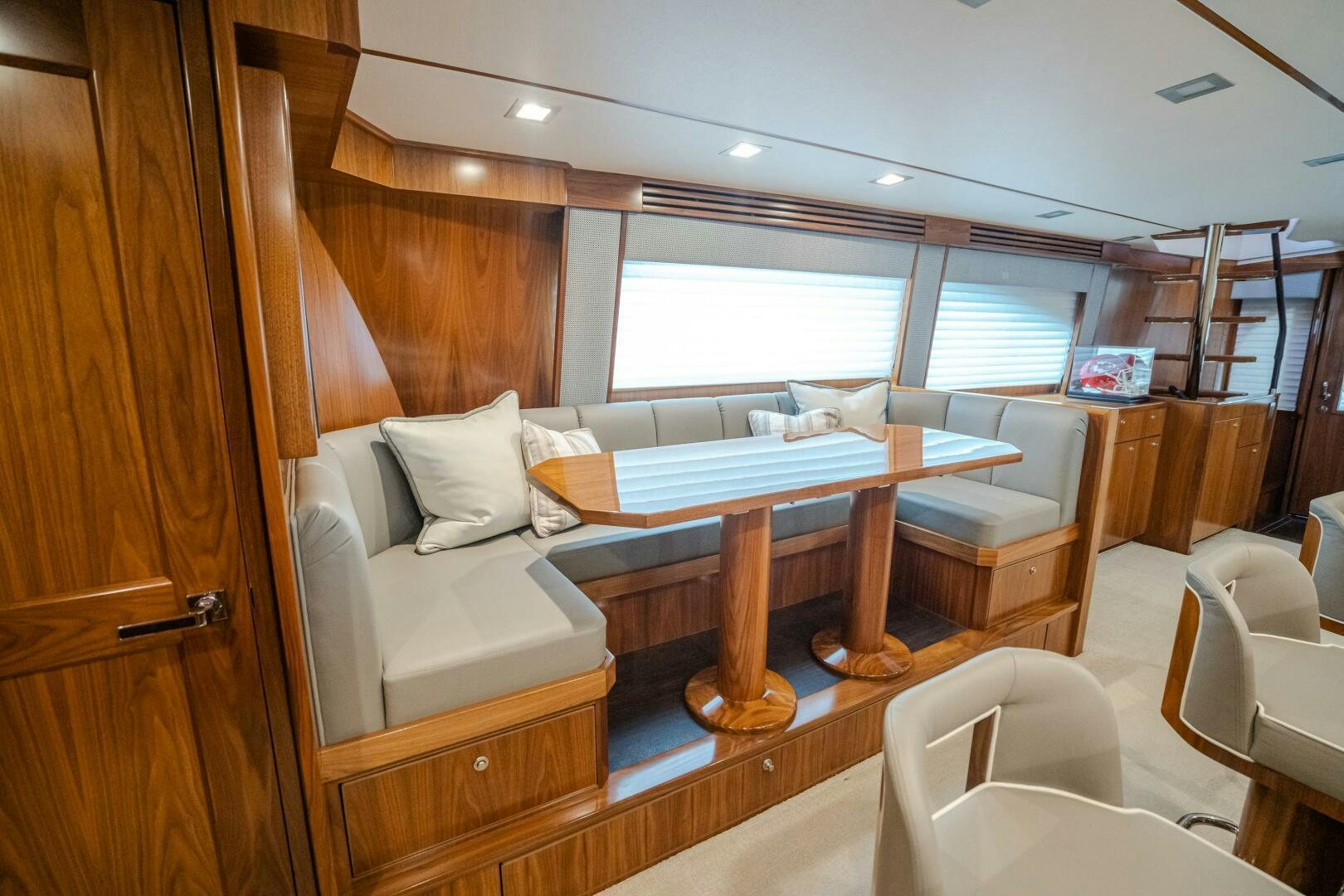 a room with a bed and a table aboard HOORAY Yacht for Sale