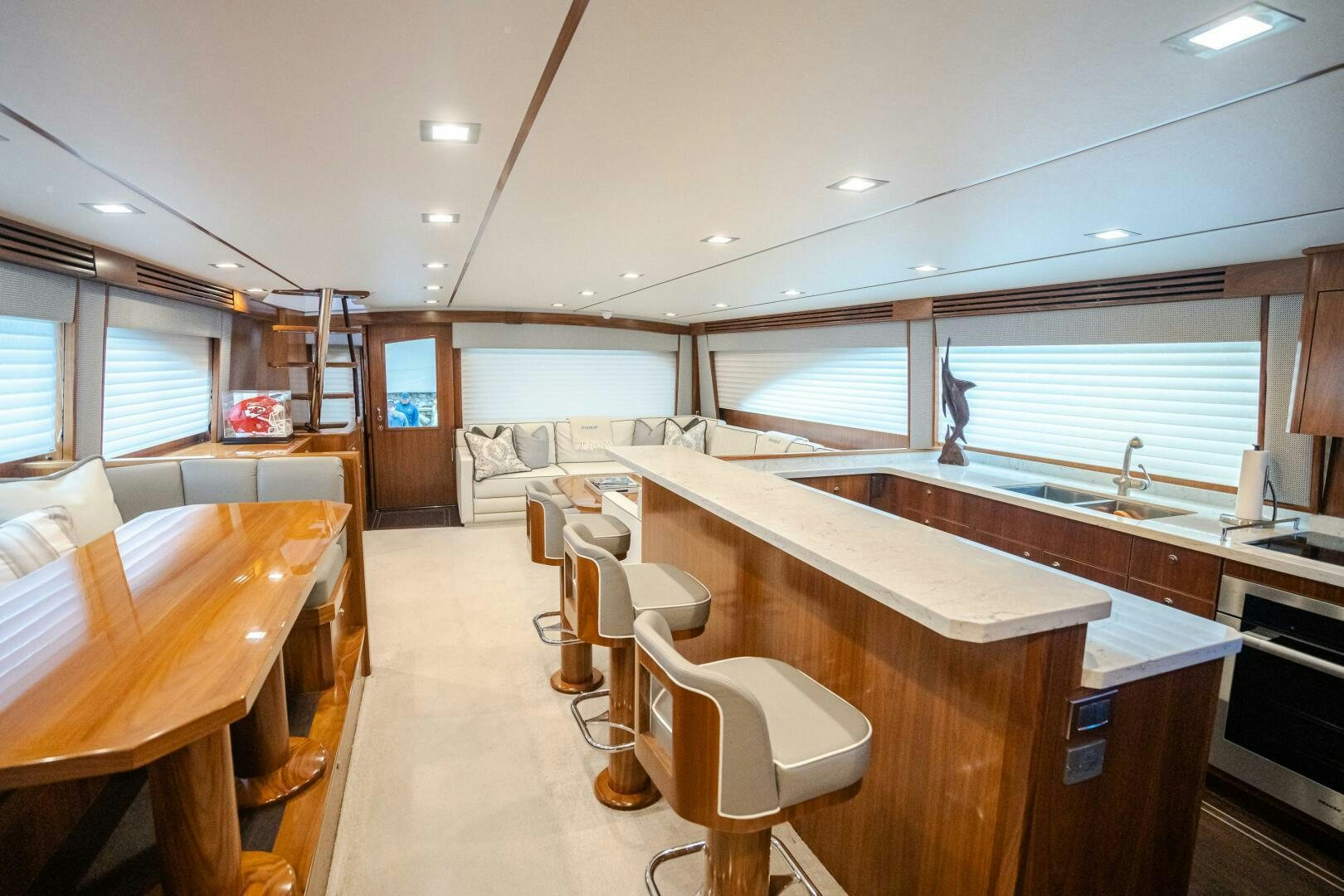 a room with a bed and desk aboard HOORAY Yacht for Sale