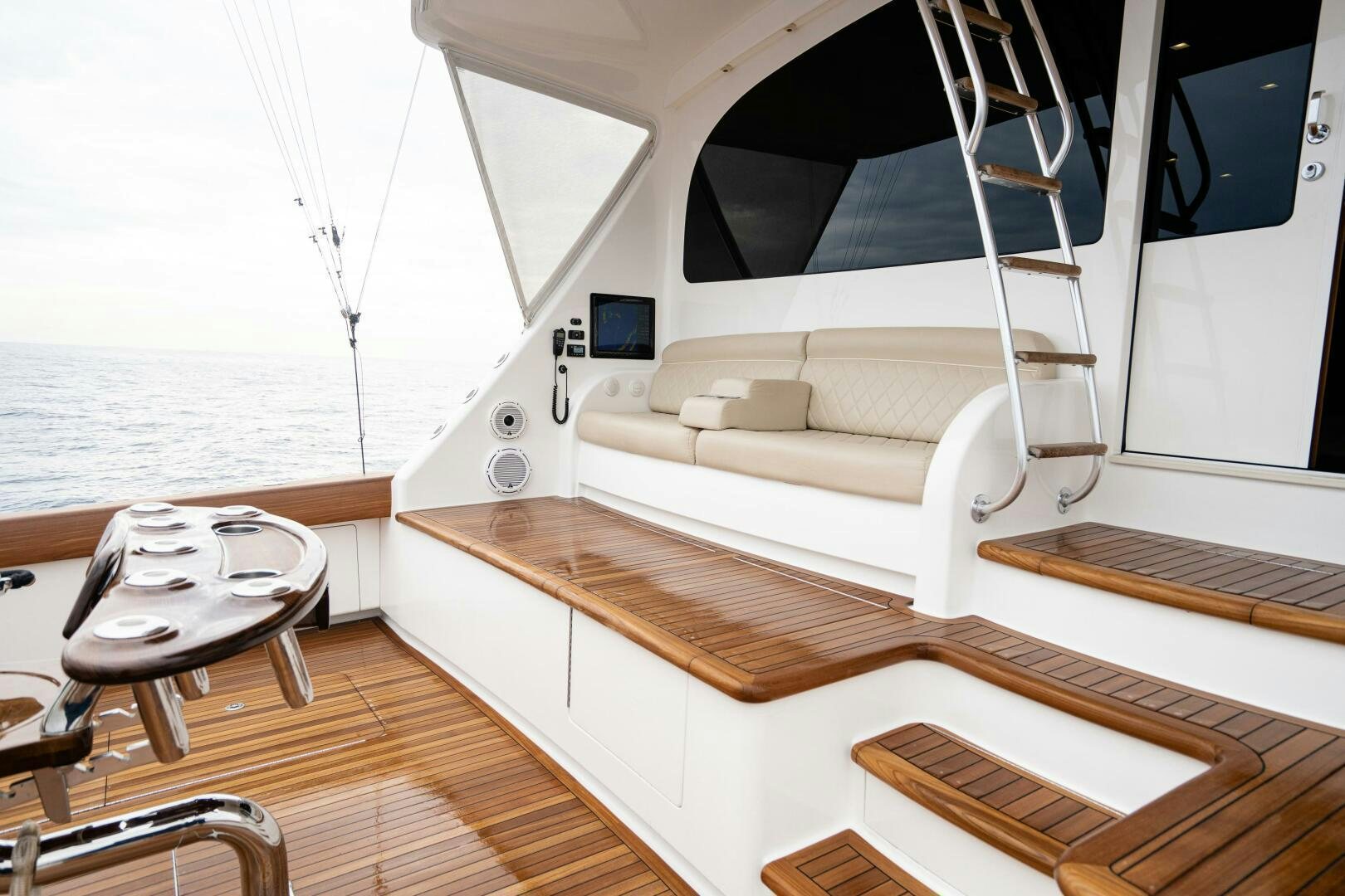 a boat with a couch aboard HOORAY Yacht for Sale
