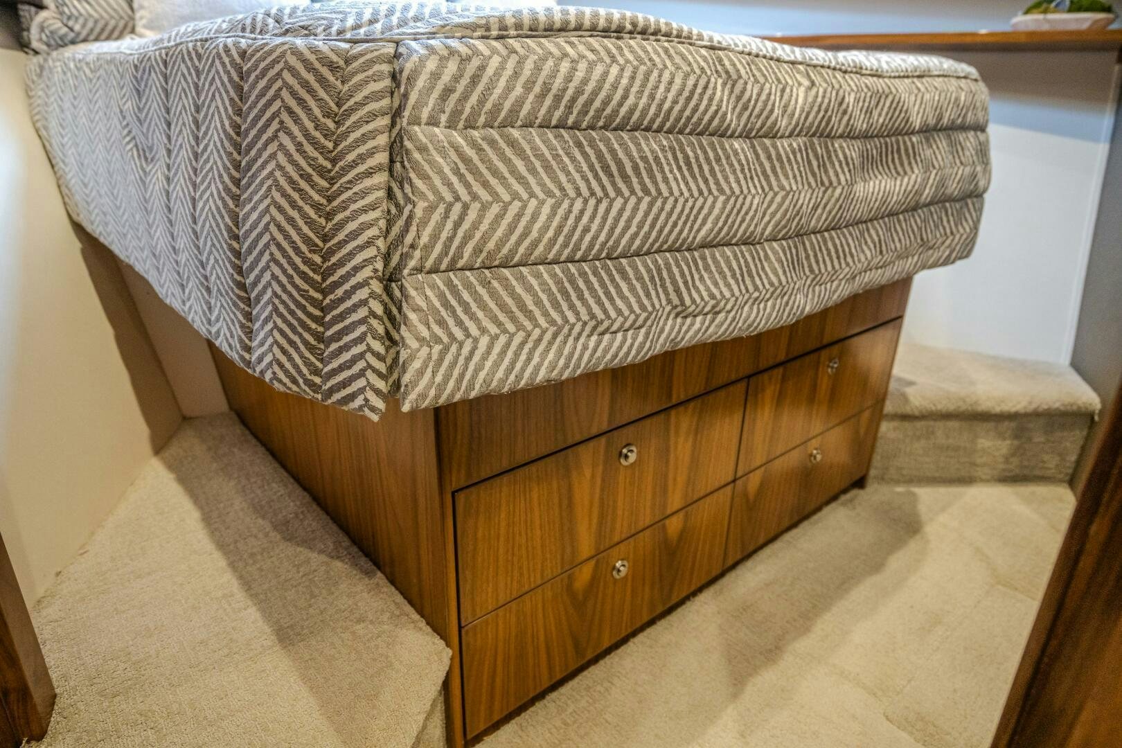 a wooden dresser in a room aboard HOORAY Yacht for Sale