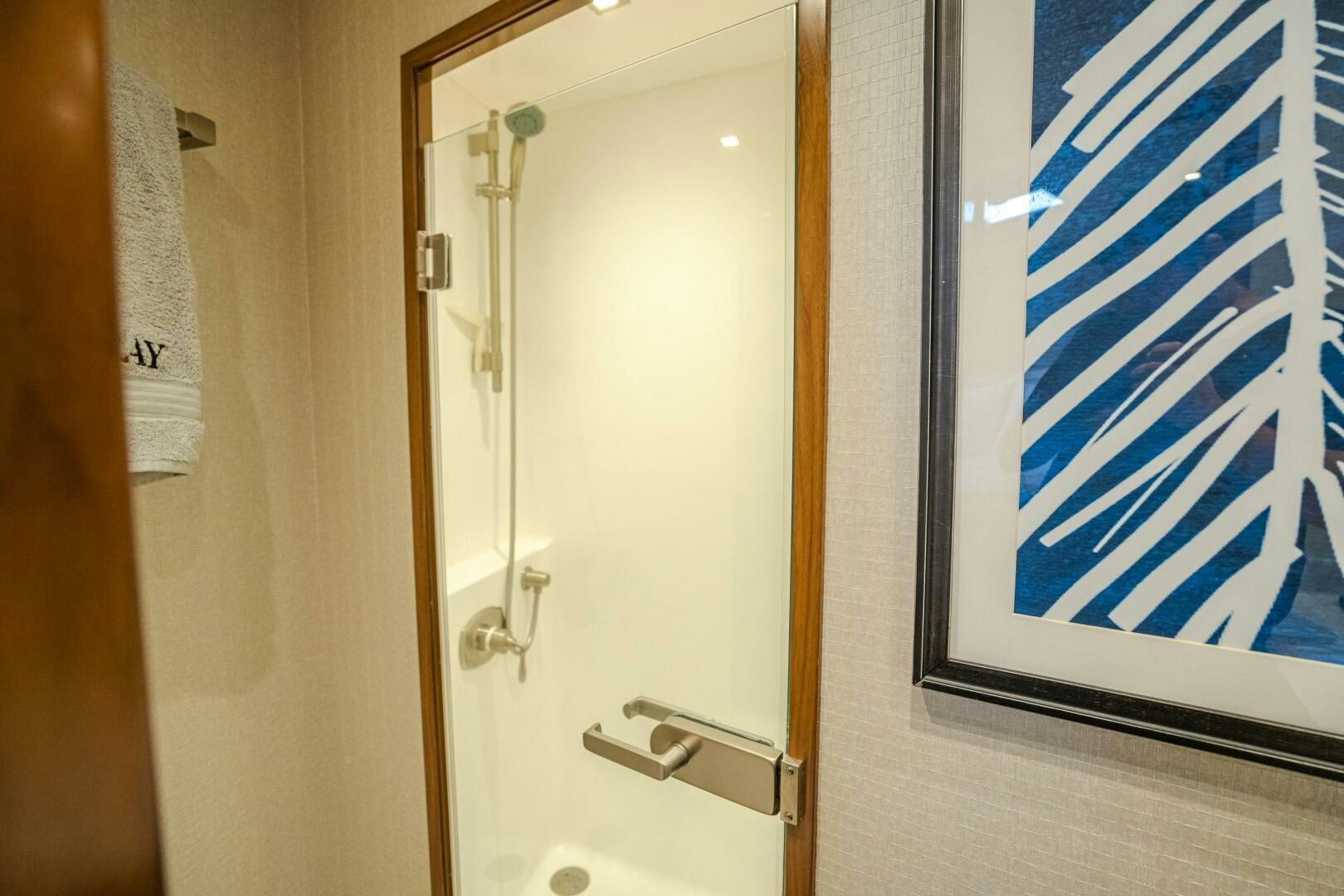 a bathroom with a glass door aboard HOORAY Yacht for Sale