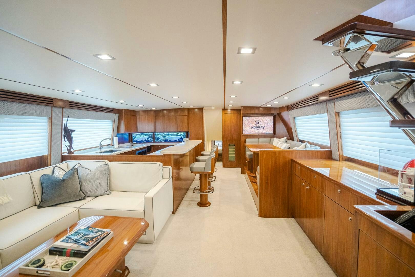 a living room with a couch and a table aboard HOORAY Yacht for Sale