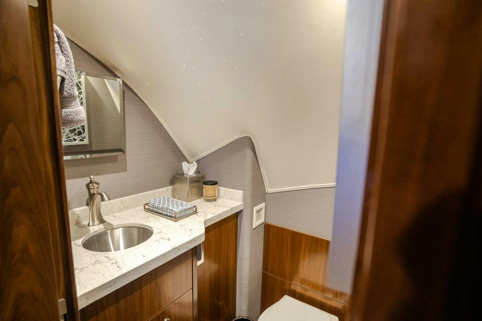a bathroom with a sink and a mirror aboard HOORAY Yacht for Sale