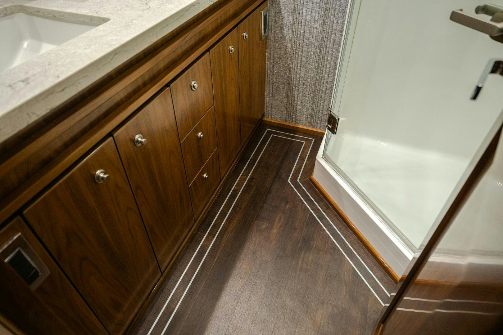 a bathroom with a countertop sink and cabinets aboard HOORAY Yacht for Sale