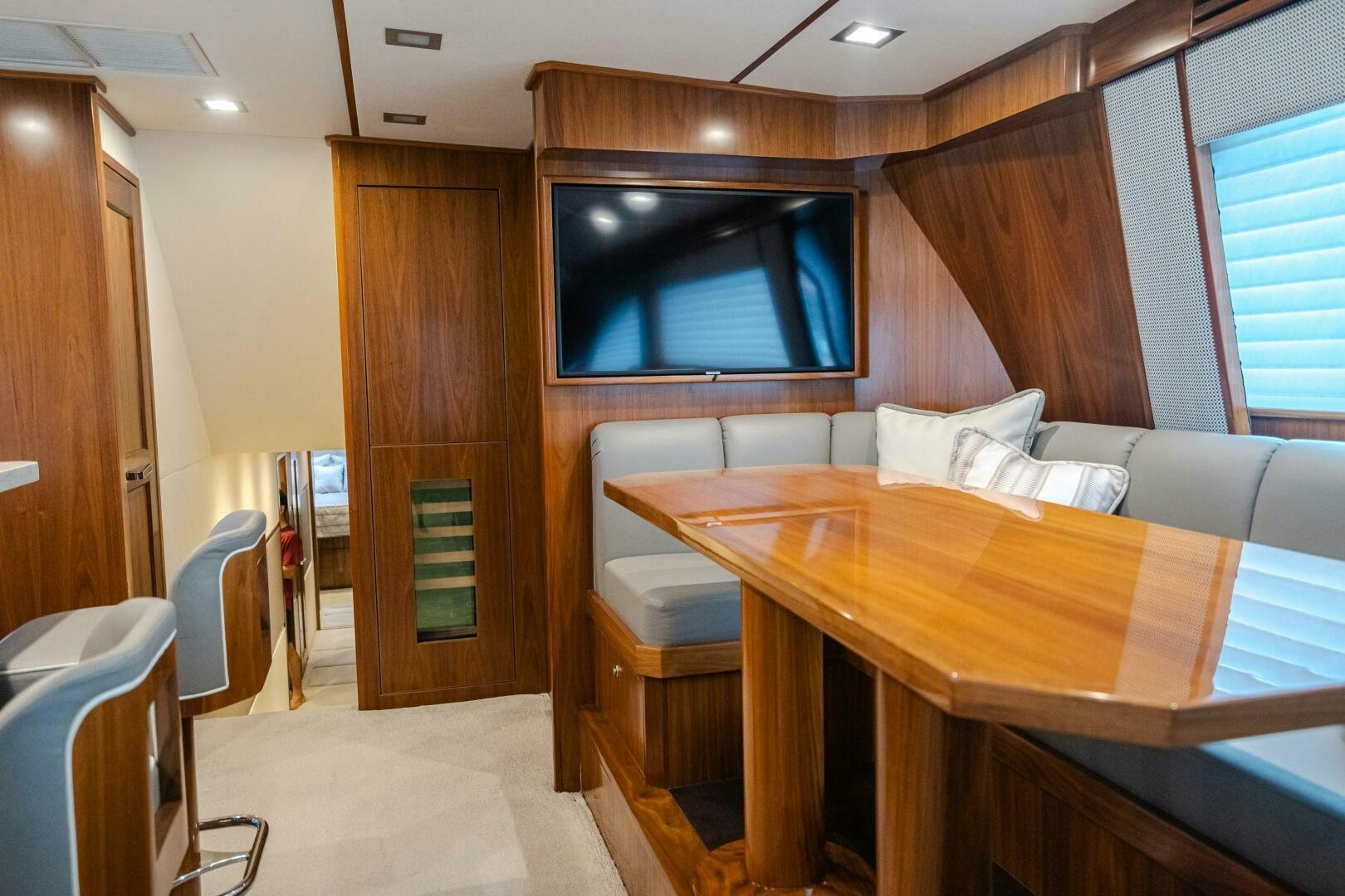 a room with a desk and a bed aboard HOORAY Yacht for Sale