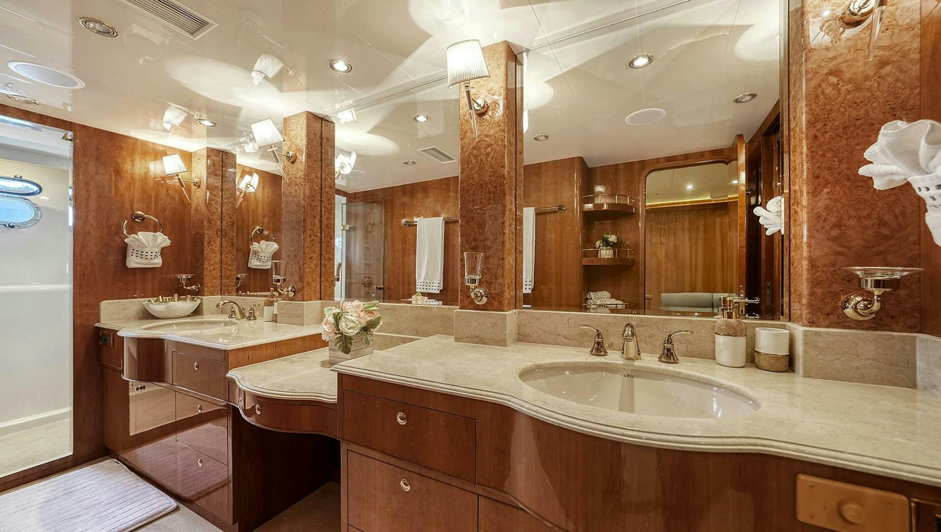 a bathroom with a large mirror aboard FANTASEA Yacht for Sale