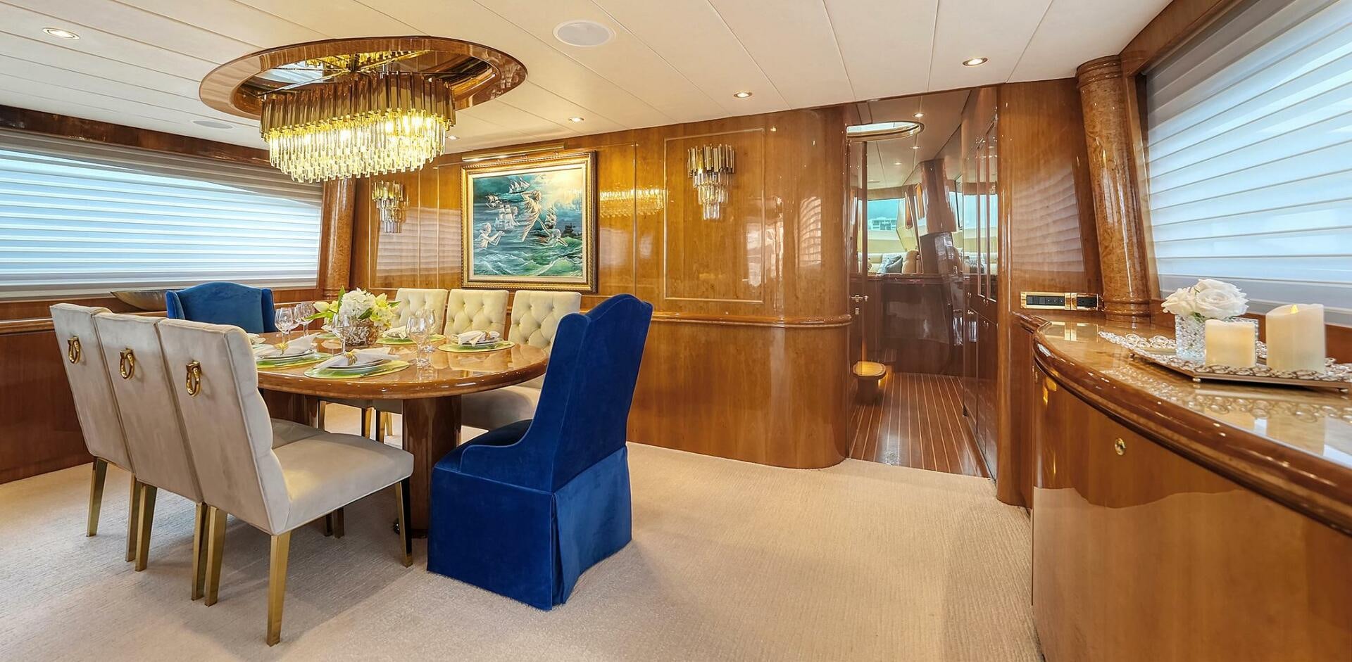 a room with a table and chairs aboard FANTASEA Yacht for Sale