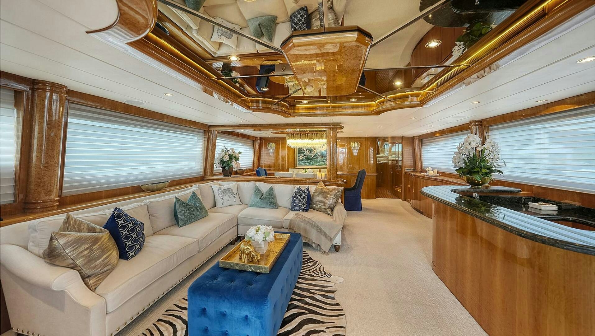 a large living room with a large open ceiling aboard FANTASEA Yacht for Sale