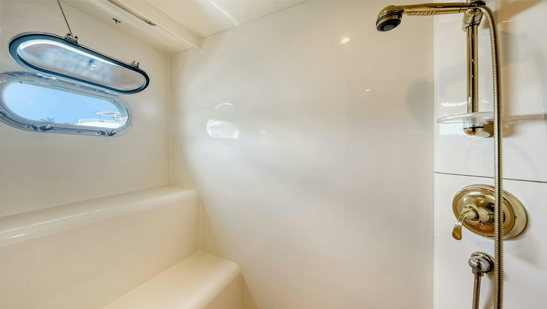 a bathroom with a shower and a sink aboard FANTASEA Yacht for Sale