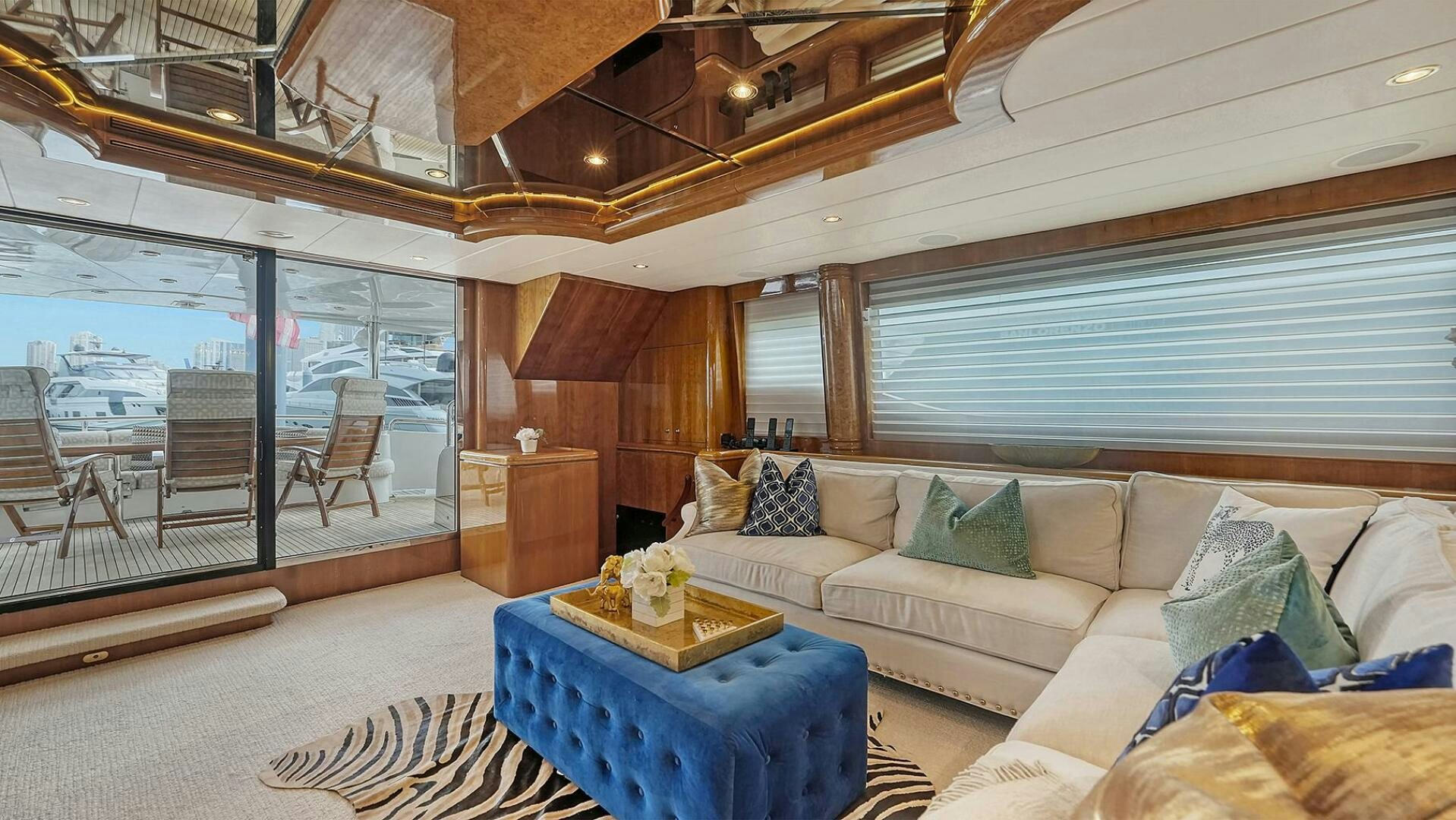 a living room with a large window aboard FANTASEA Yacht for Sale