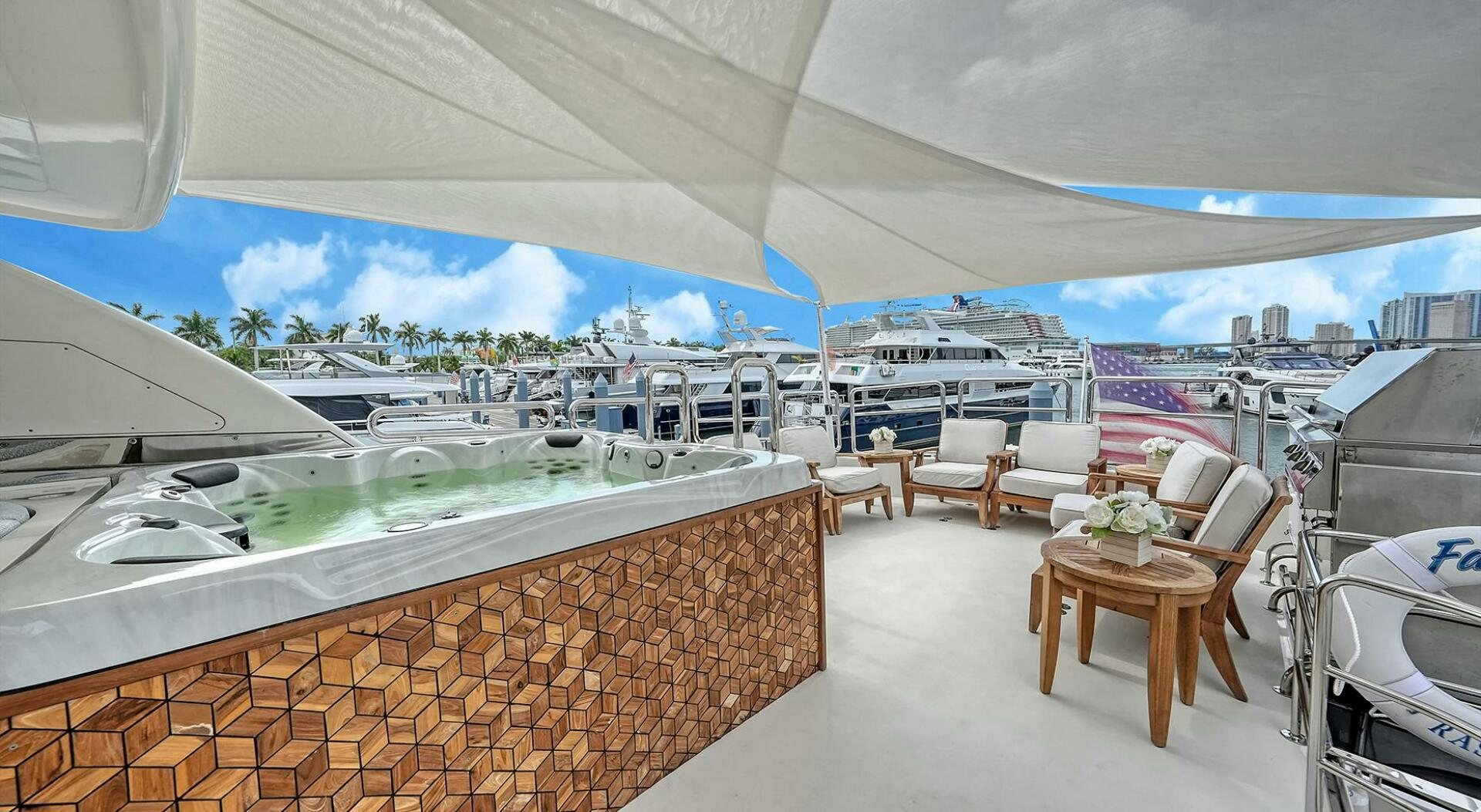 a room with a view of the city and water aboard FANTASEA Yacht for Sale