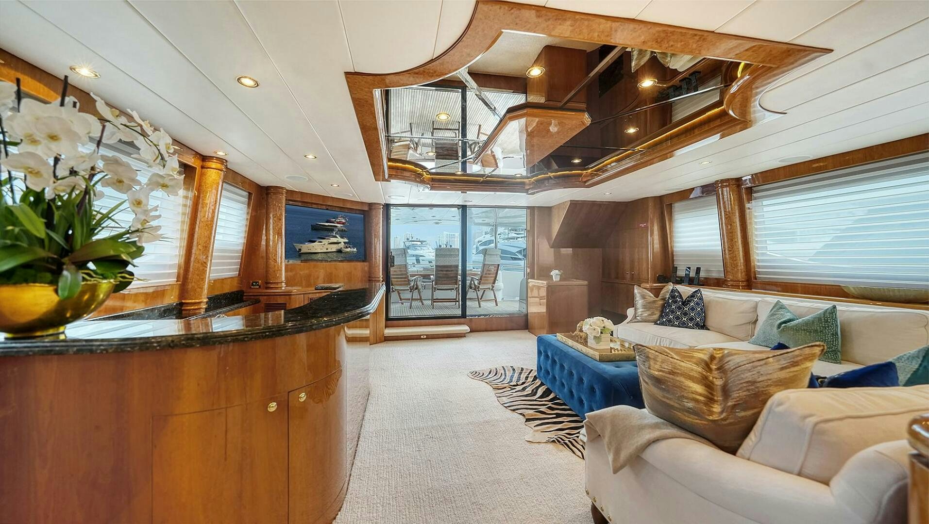 a room with a couch and a table aboard FANTASEA Yacht for Sale