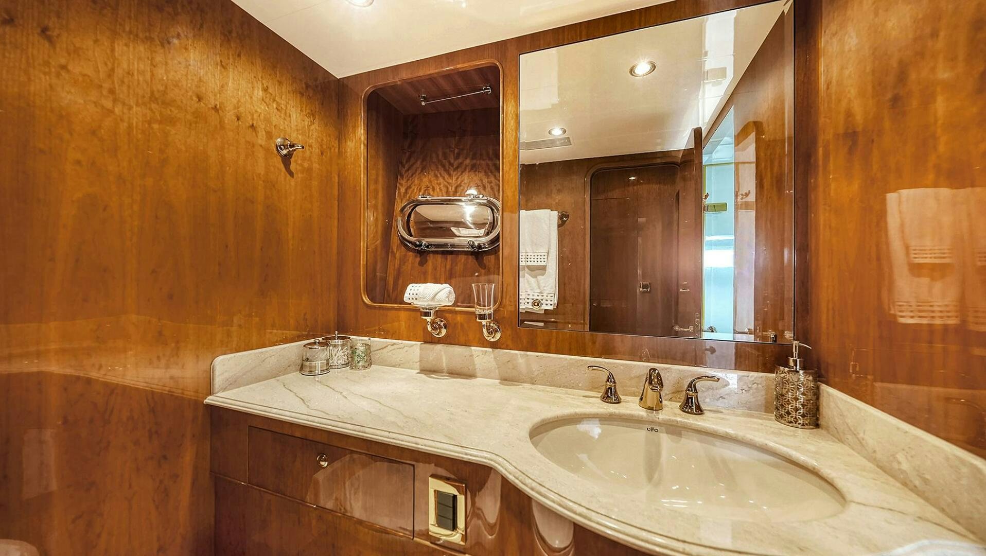 a bathroom with a large mirror aboard FANTASEA Yacht for Sale