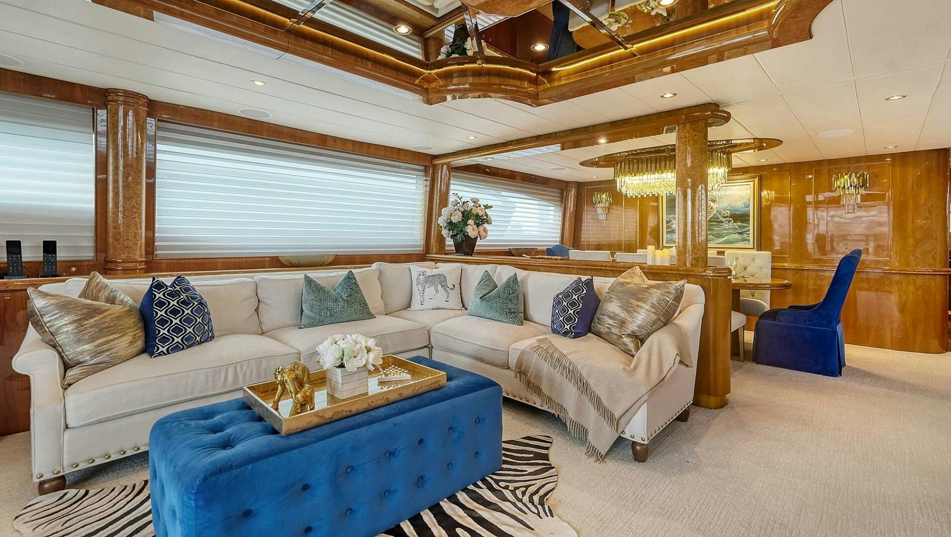 a living room with a couch and a table aboard FANTASEA Yacht for Sale