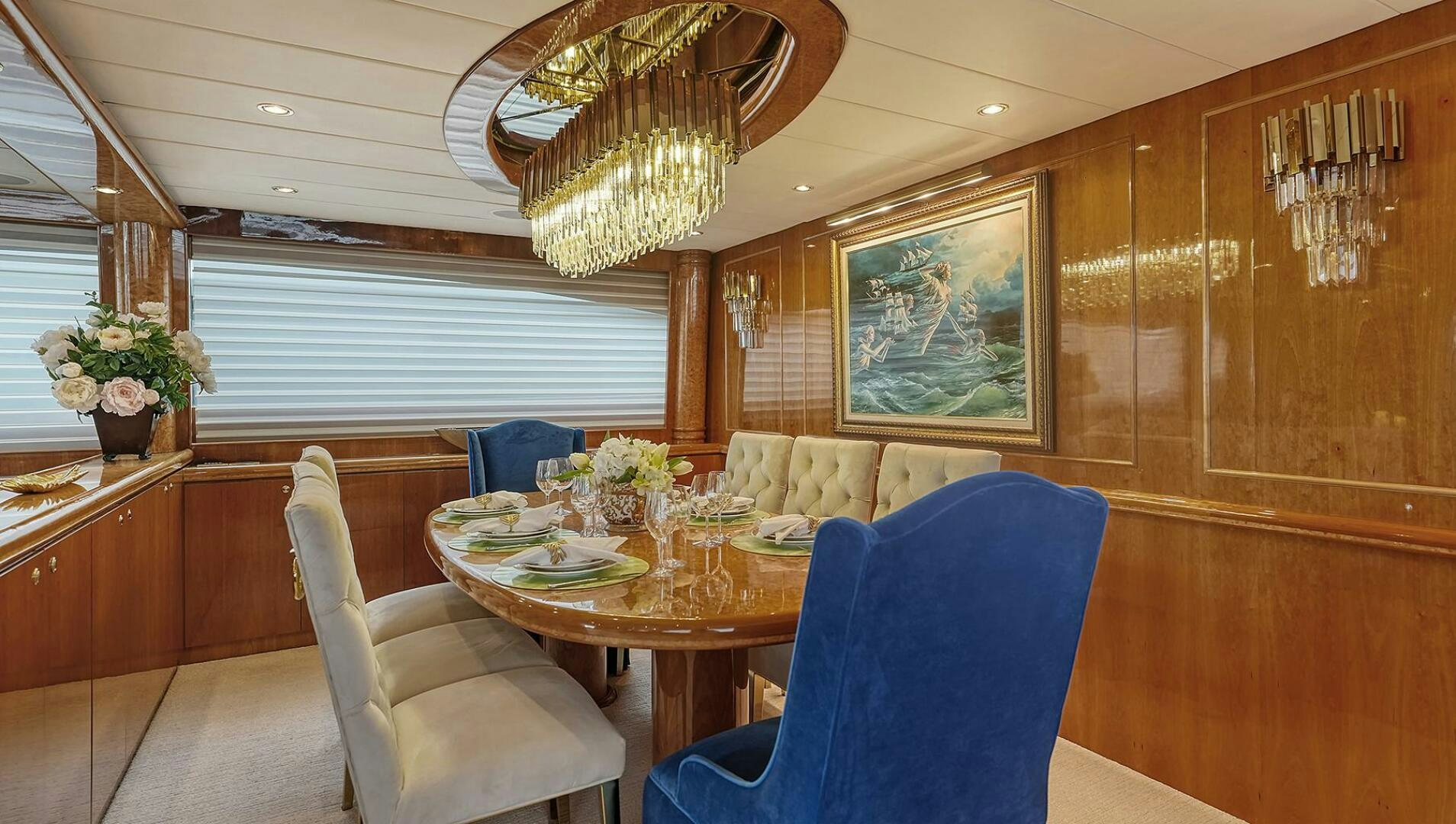 a dining room with a table aboard FANTASEA Yacht for Sale
