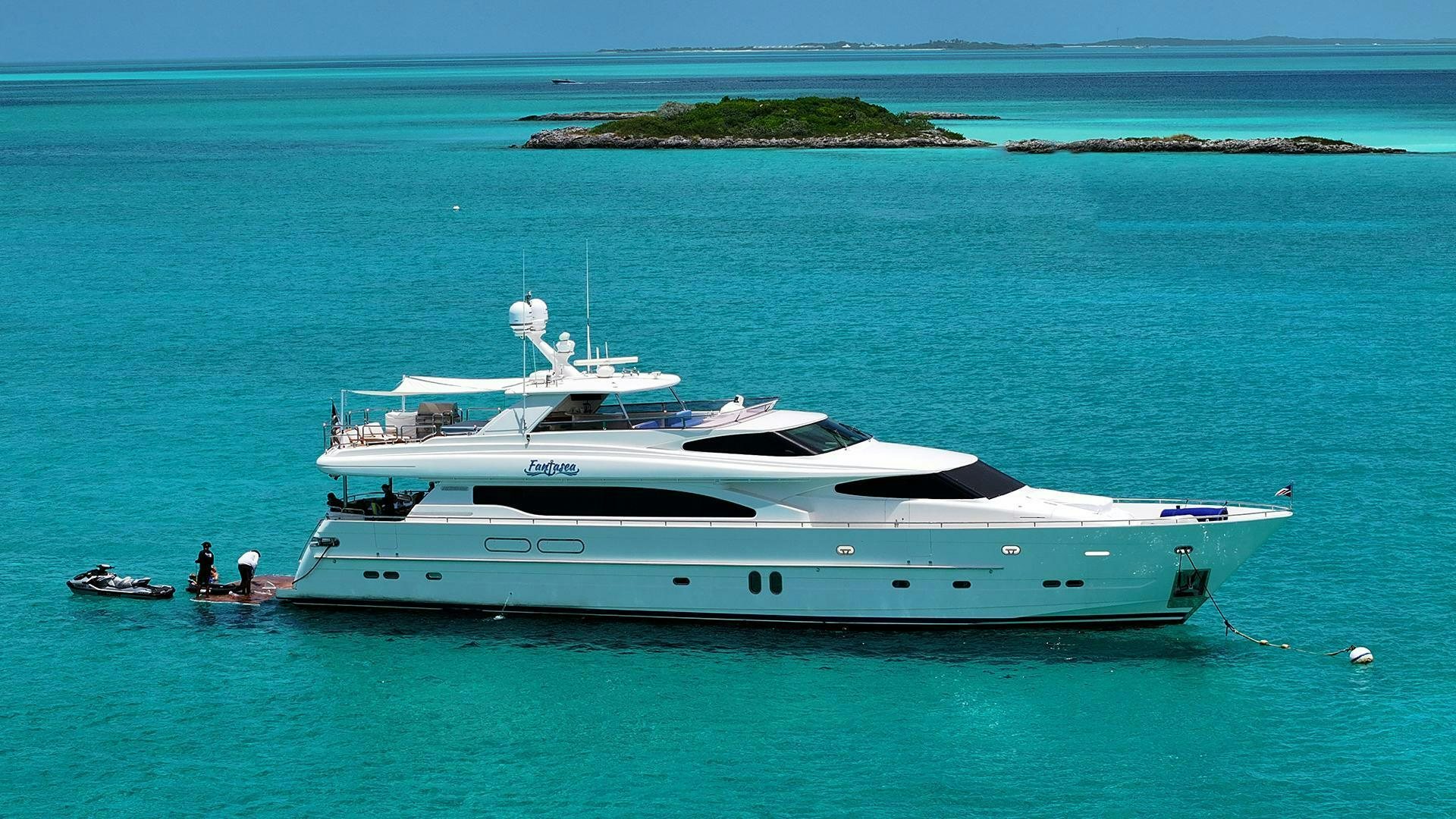 a white yacht in the water aboard FANTASEA Yacht for Sale