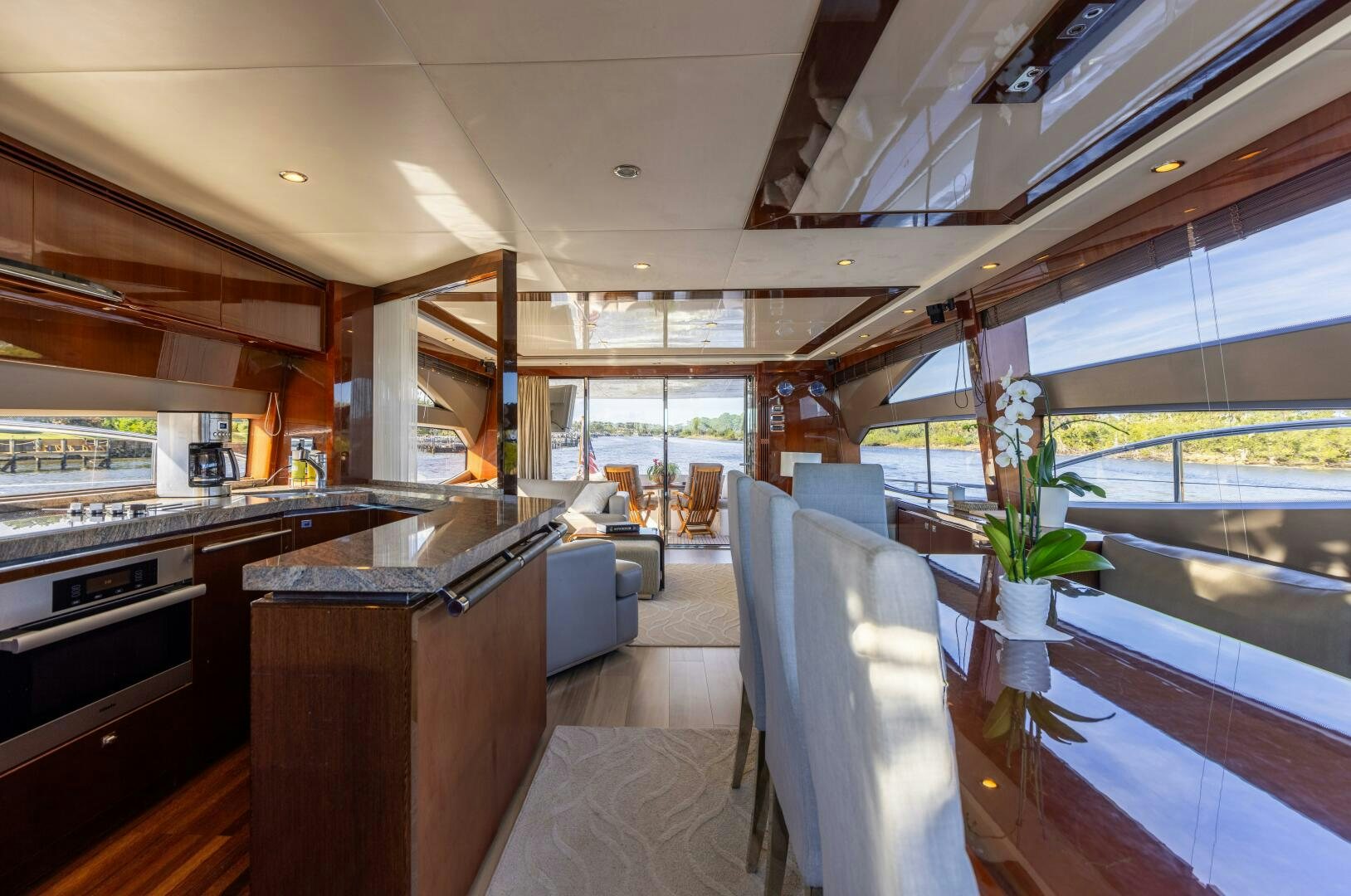 a kitchen with a large window aboard MISS DORI Yacht for Sale