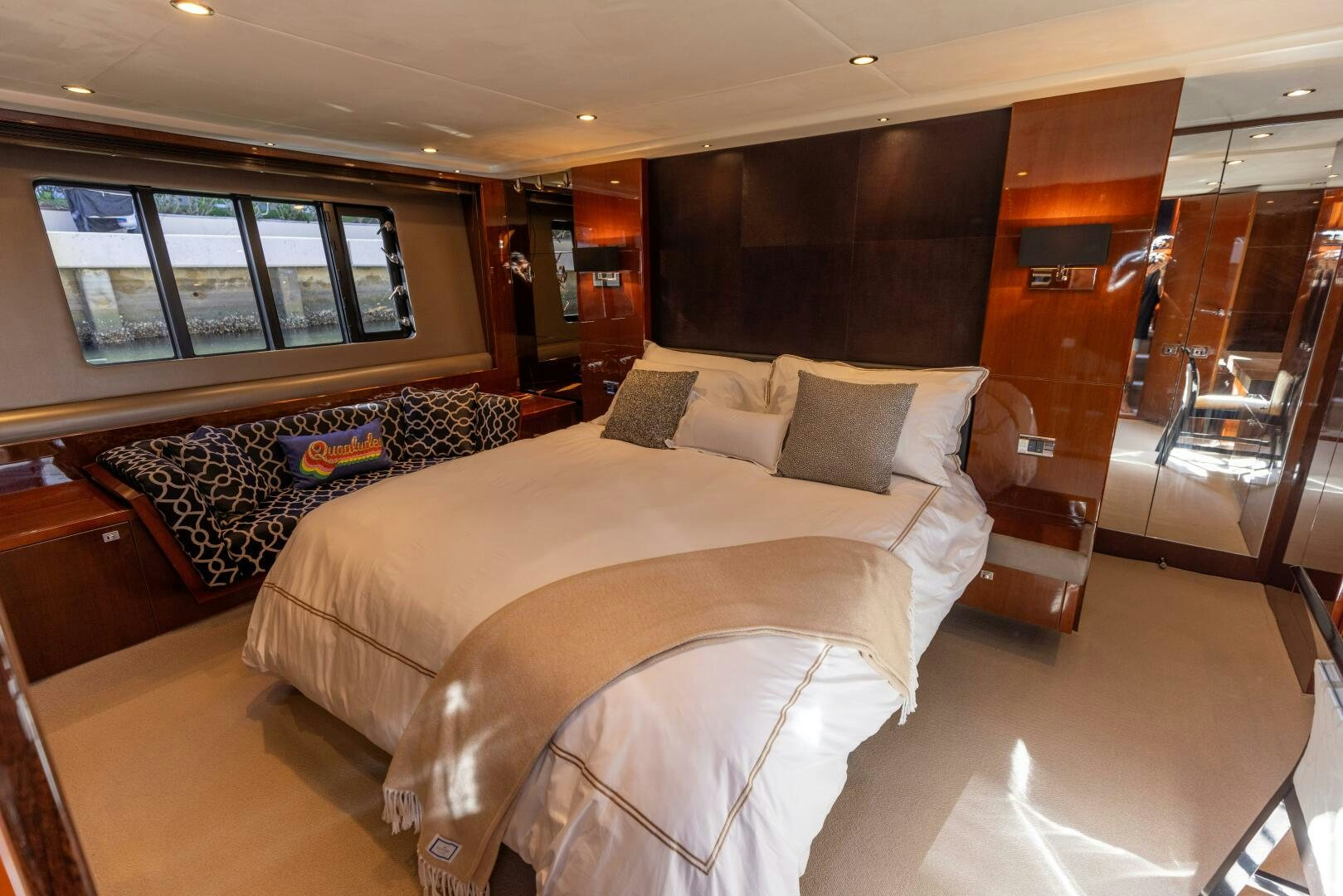 a room with a bed and a table aboard MISS DORI Yacht for Sale
