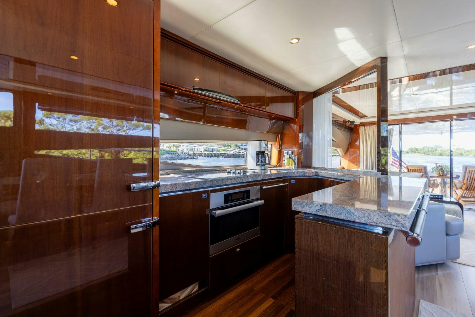 a kitchen with wooden cabinets aboard MISS DORI Yacht for Sale